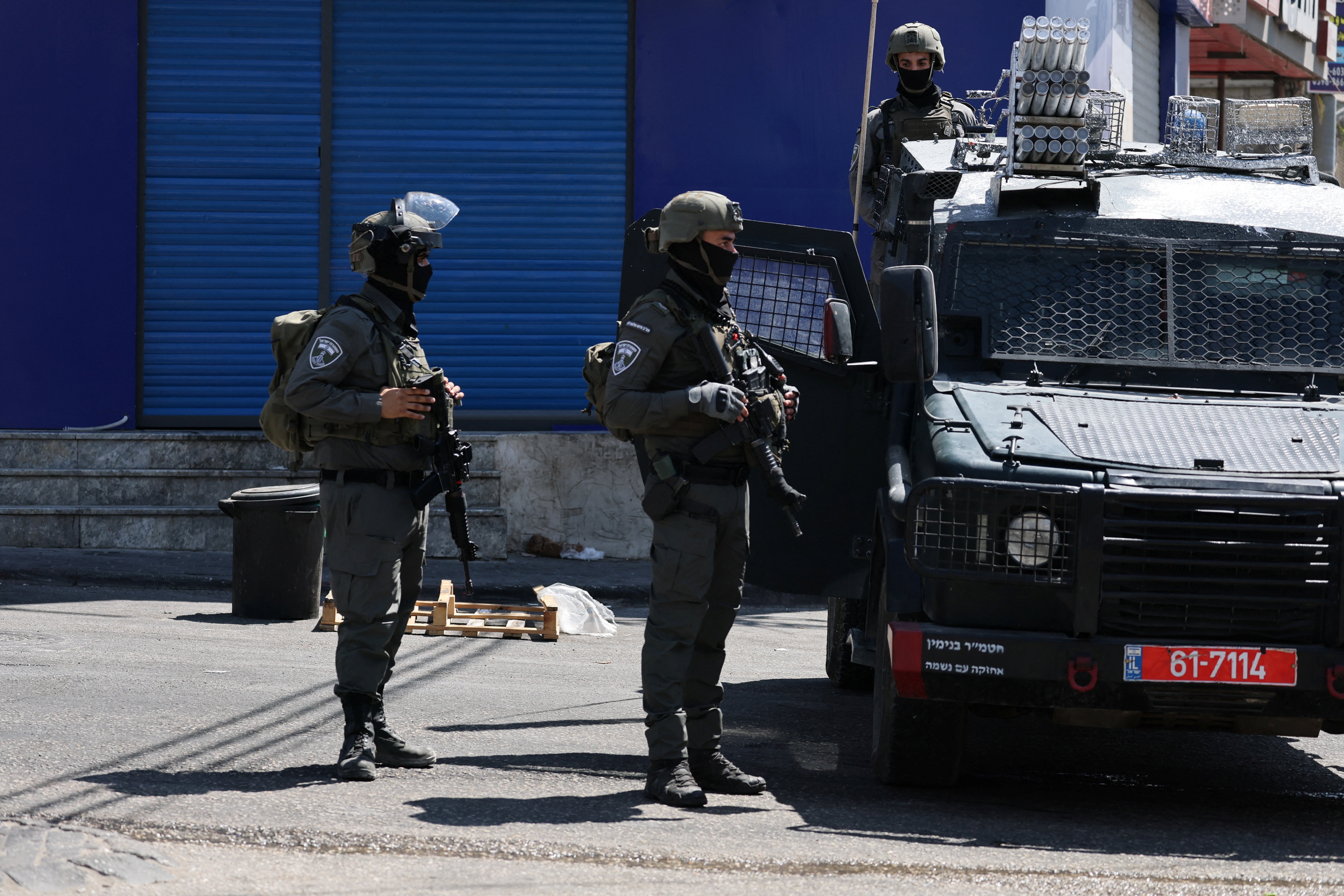 Israeli forces take part in a raid in Qalandia refugee camp, in the Israeli-occupied West Bank, August 6, 2026. REUTERS/Ammar Awad