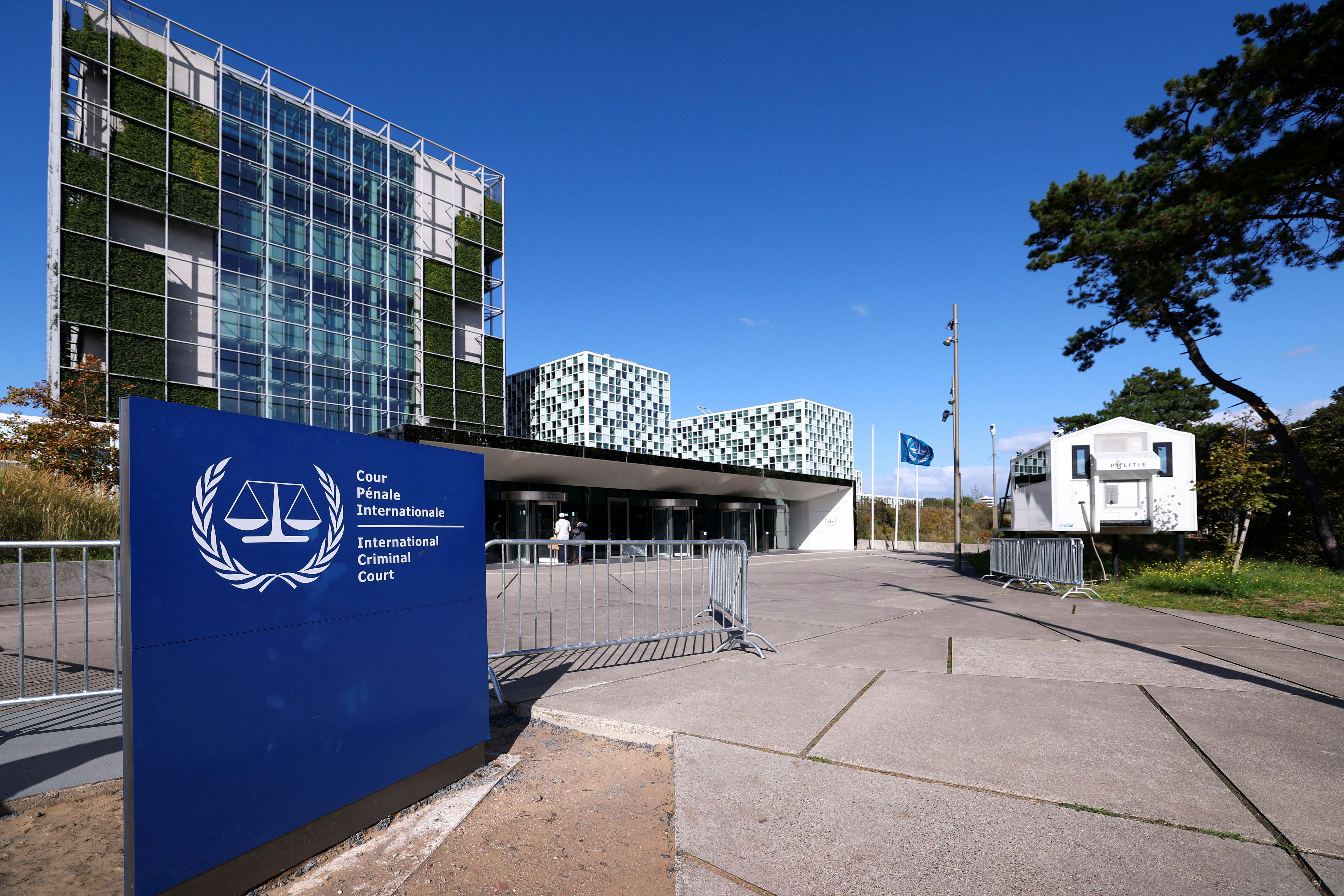 FILE PHOTO: People stand outside the International Criminal Court in the Hague, Netherlands, September 22, 2025. REUTERS/Piroschka van de Wouw/File Photo