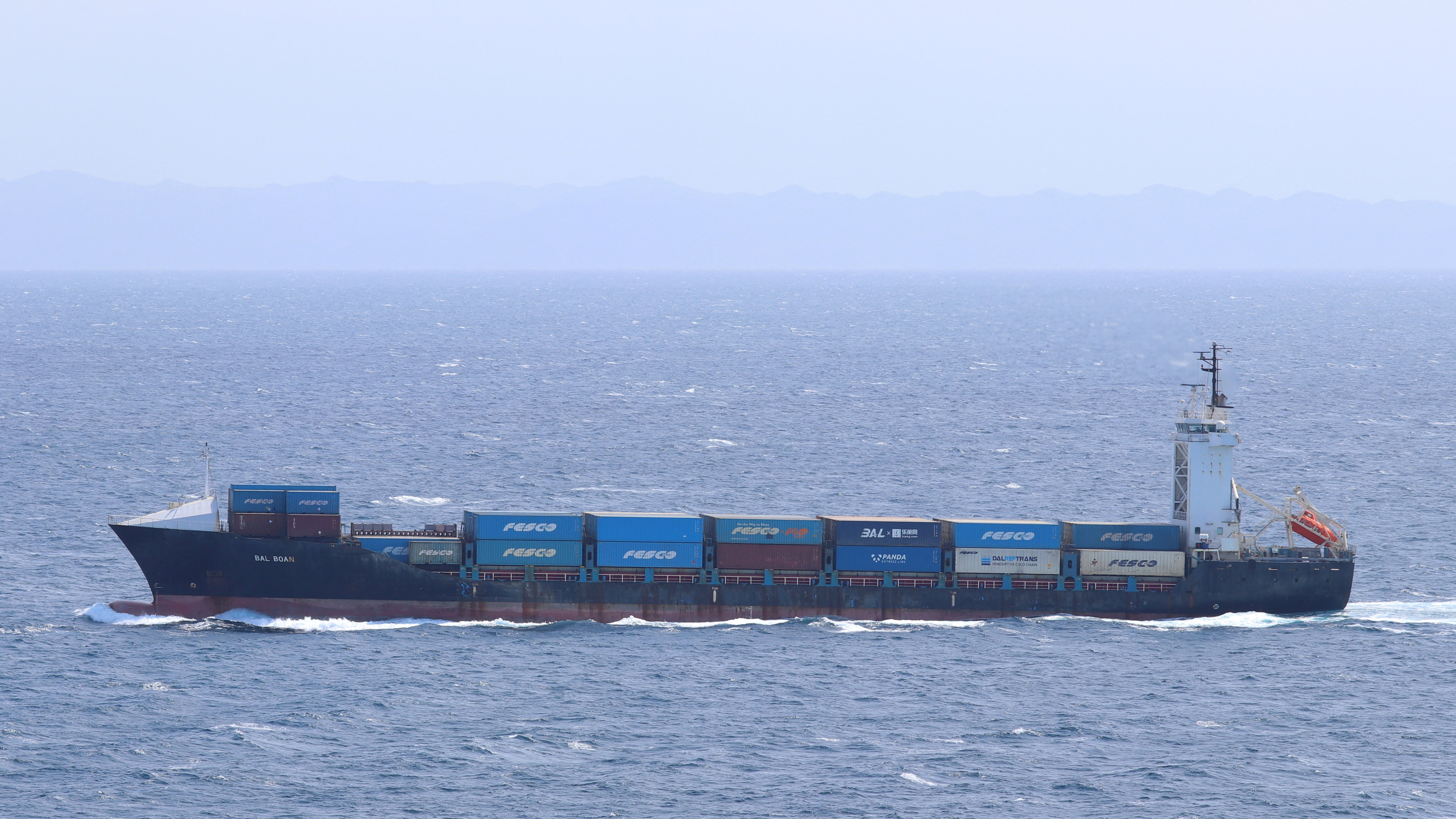 The container ship Vela Nova, formerly named Bal Boan, sails at sea off Tsushima Island, Nagasaki Prefecture, Japan, March 19, 2024, in this archive image. The Panama-flagged vessel was struck by a missile while sailing toward the Gulf of Oman on August 11, 2026, according to maritime security sources. Vladimir Tonic/Handout via REUTERS THIS IMAGE HAS BEEN SUPPLIED BY A THIRD PARTY. NO RESALES. NO ARCHIVES. MANDATORY CREDIT VERIFICATION: - Reuters verified the identity of the vessel in the photograph as the Vela Nova (IMO: 9136228) and that the name Bal Boan is one of the previous names of the ship. - The location was confirmed by the source. - The date when the picture was taken was verified by the original file metadata.