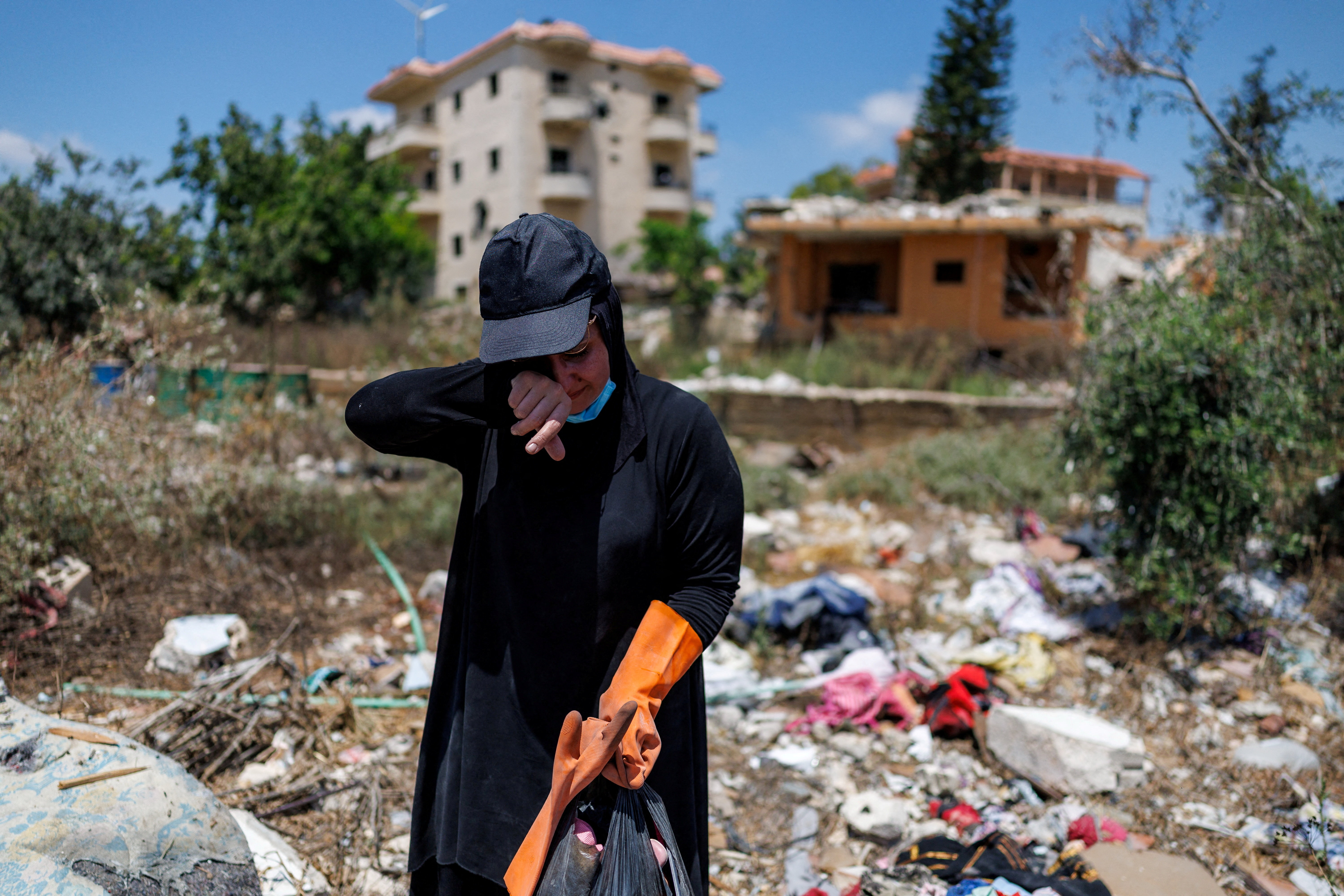 Nour Hamzeh reacts as she speaks about her memories of her house, which was destroyed in an Israeli strike, after returning to Zawtar al-Gharbiyeh in southern Lebanon following the deployment of Lebanese soldiers in one of three so-called pilot zones established after the withdrawal of Israeli forces under a U.S.-brokered plan, July 27, 2026. REUTERS/Zohra Bensemra TPX IMAGES OF THE DAY
