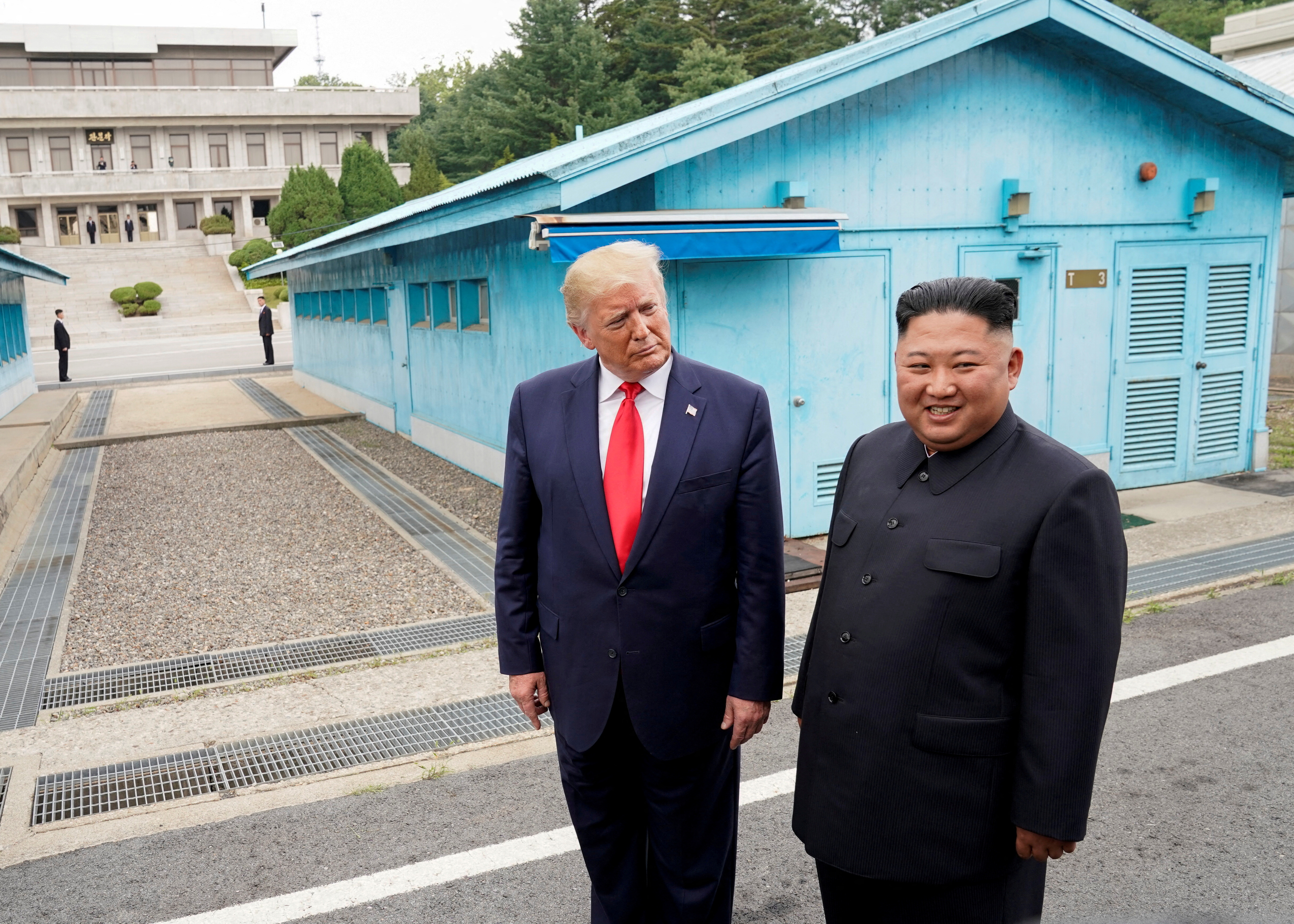US President Donald Trump meets with North Korean leader Kim Jong Un at the demilitarized zone separating the two Koreas, in Panmunjom, South Korea, June 30, 2019 [Kevin Lamarque/Reuters]
