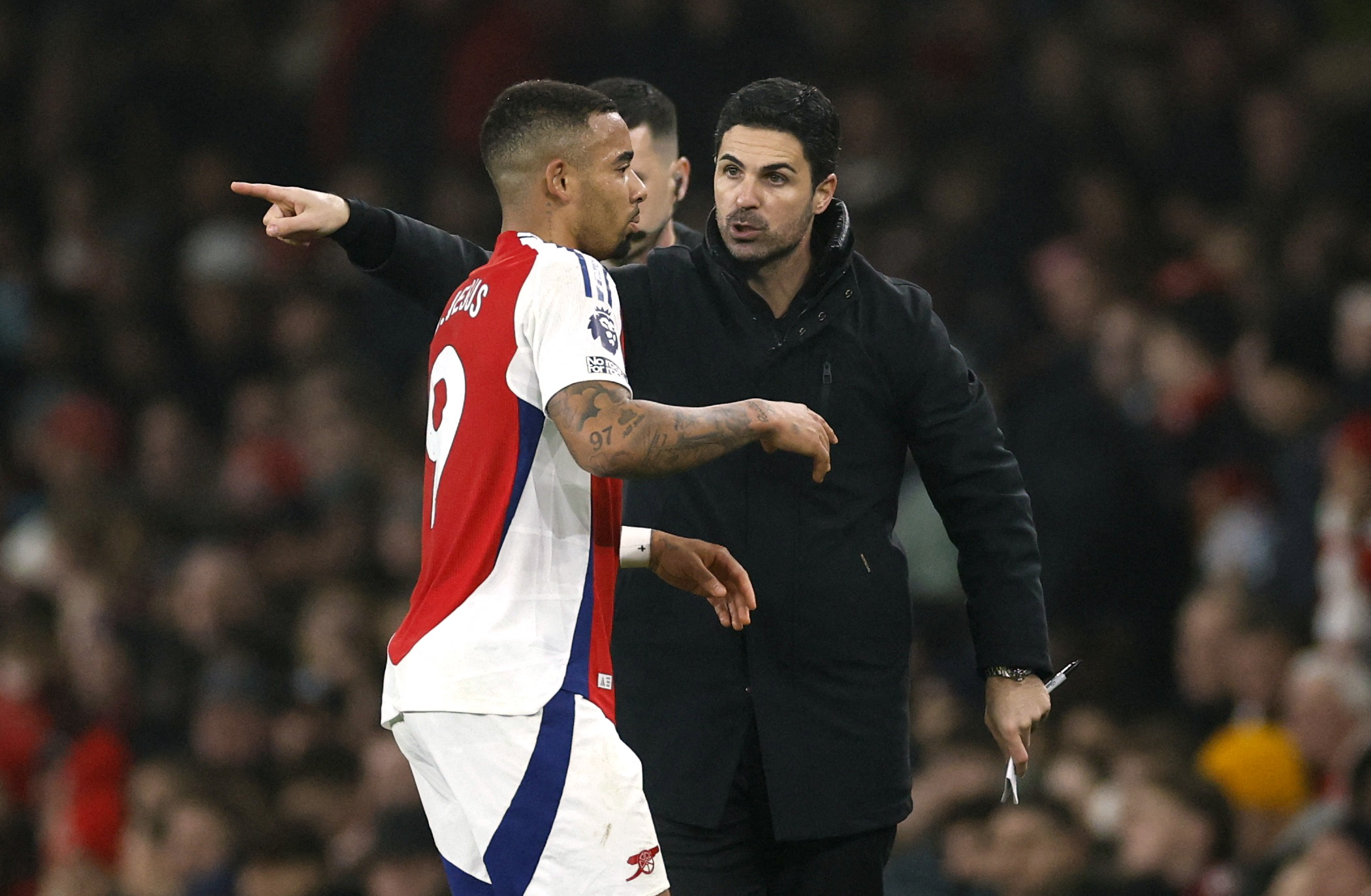 Arsenal manager Mikel Arteta reacts with Gabriel Jesus.