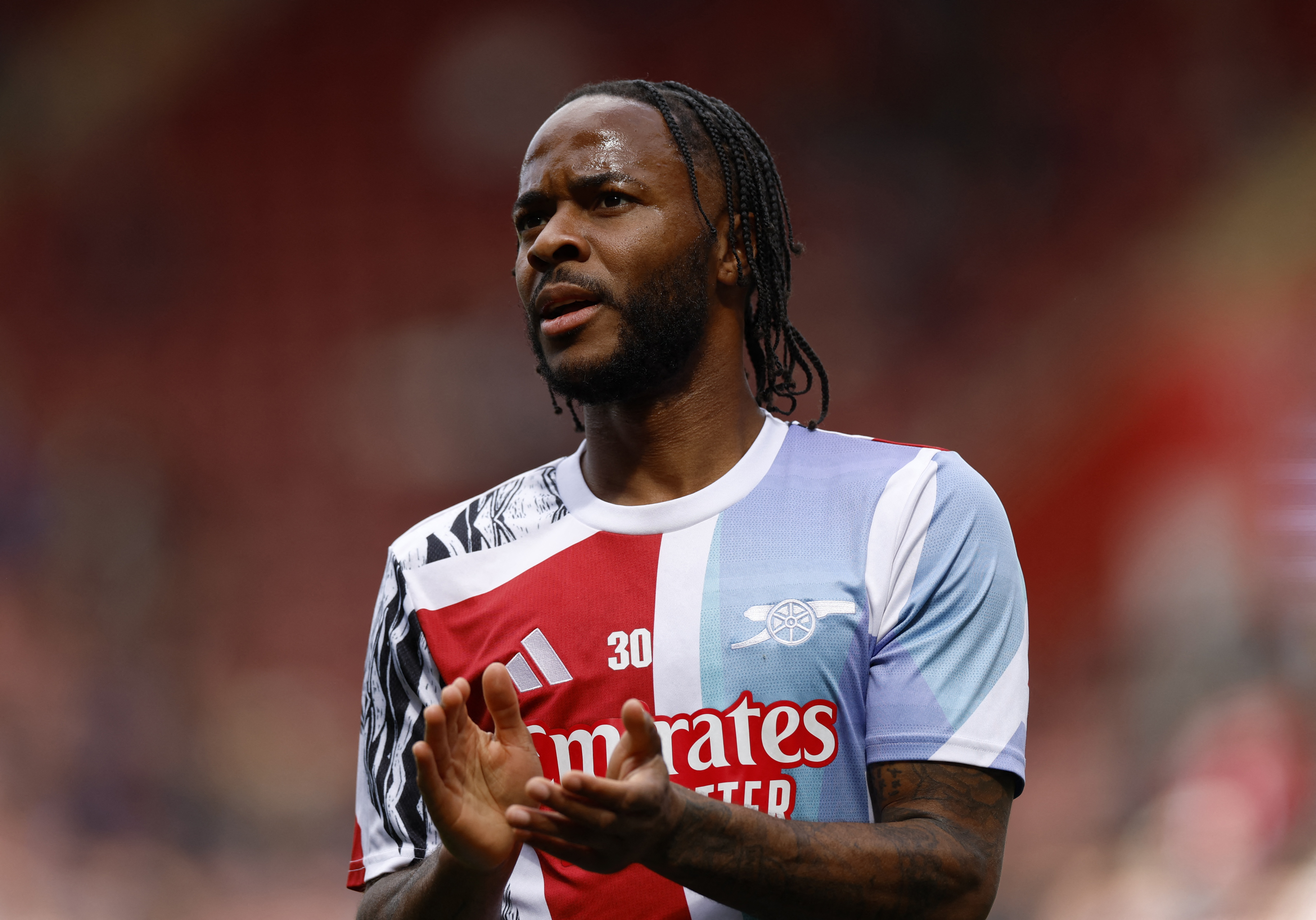 Raheem Sterling applauds the Arsenal fans in January 2025 during his last Premier League stint