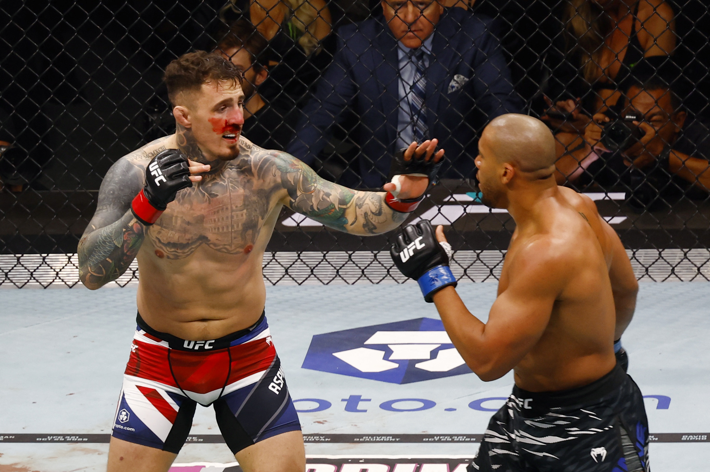 Mixed Martial Arts - UFC 321 - UFC Heavyweight Title - Tom Aspinall v Ciryl Gane - Etihad Arena, Abu Dhabi, United Arab Emirates - October 25, 2025 Tom Aspinall in action during his fight against Ciryl Gane REUTERS/Rula Rouhana