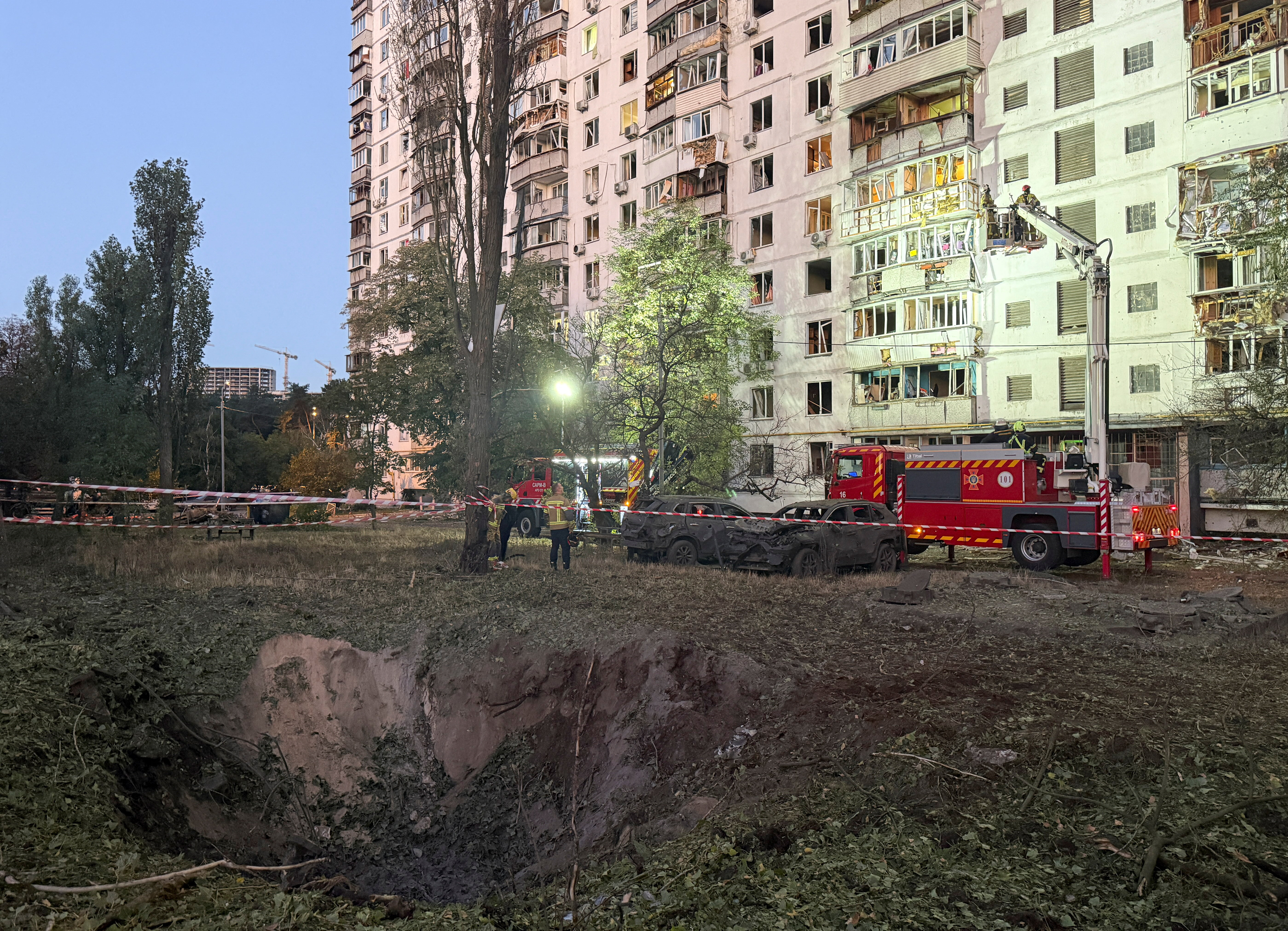 Rescuers work at the site of an apartment building damaged during a Russian air strike in Kyiv, Ukraine on September 17, 2026.