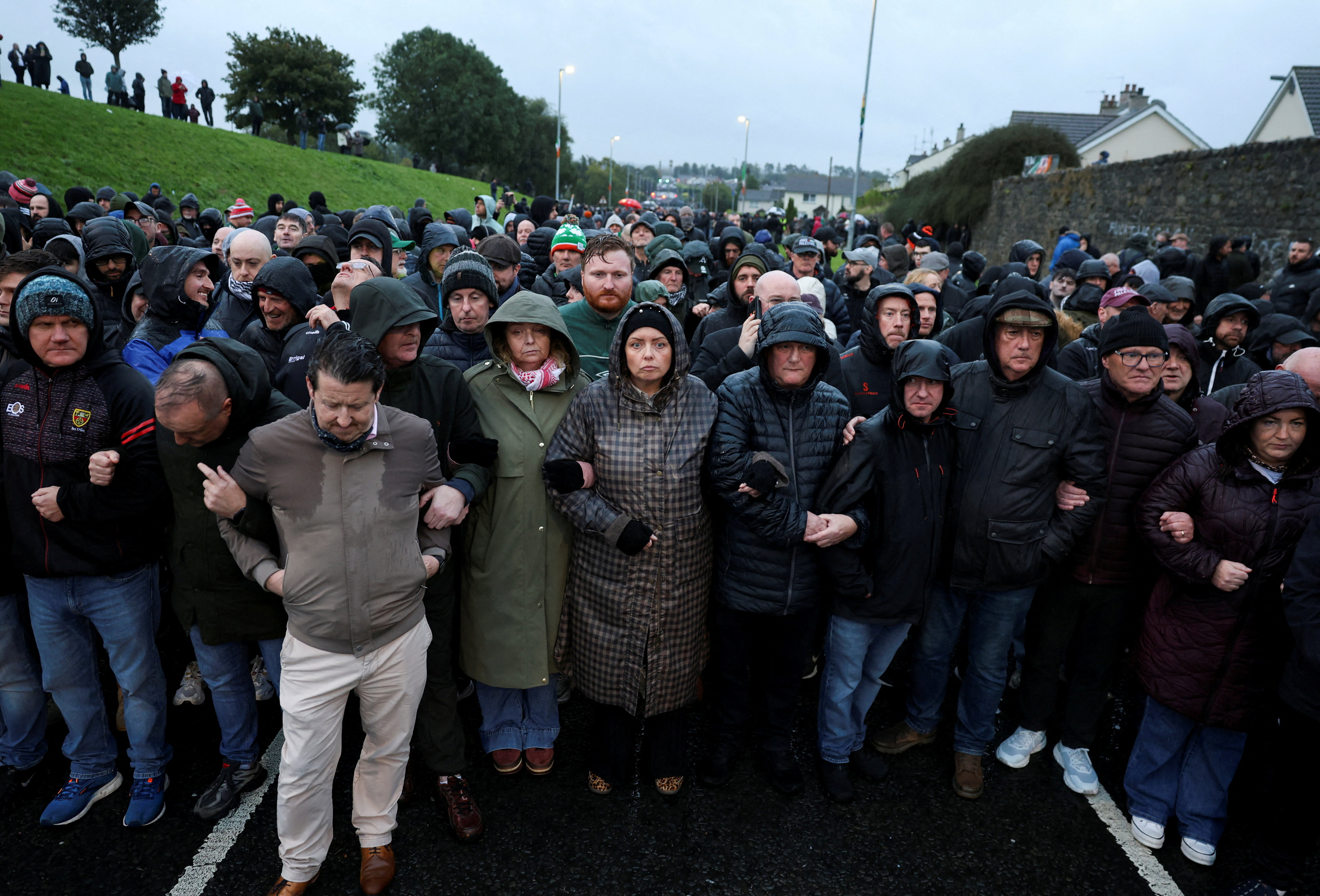 People block the Garvaghy road, a Catholic enclave in the largely Protestant town of Portadown, on the day members of the Protestant Orange Order are expected to march through the area as they take part in the annual Drumcree parade, Northern Ireland, September 27, 2026. REUTERS/Cathal McNaughton TPX IMAGES OF THE DAY