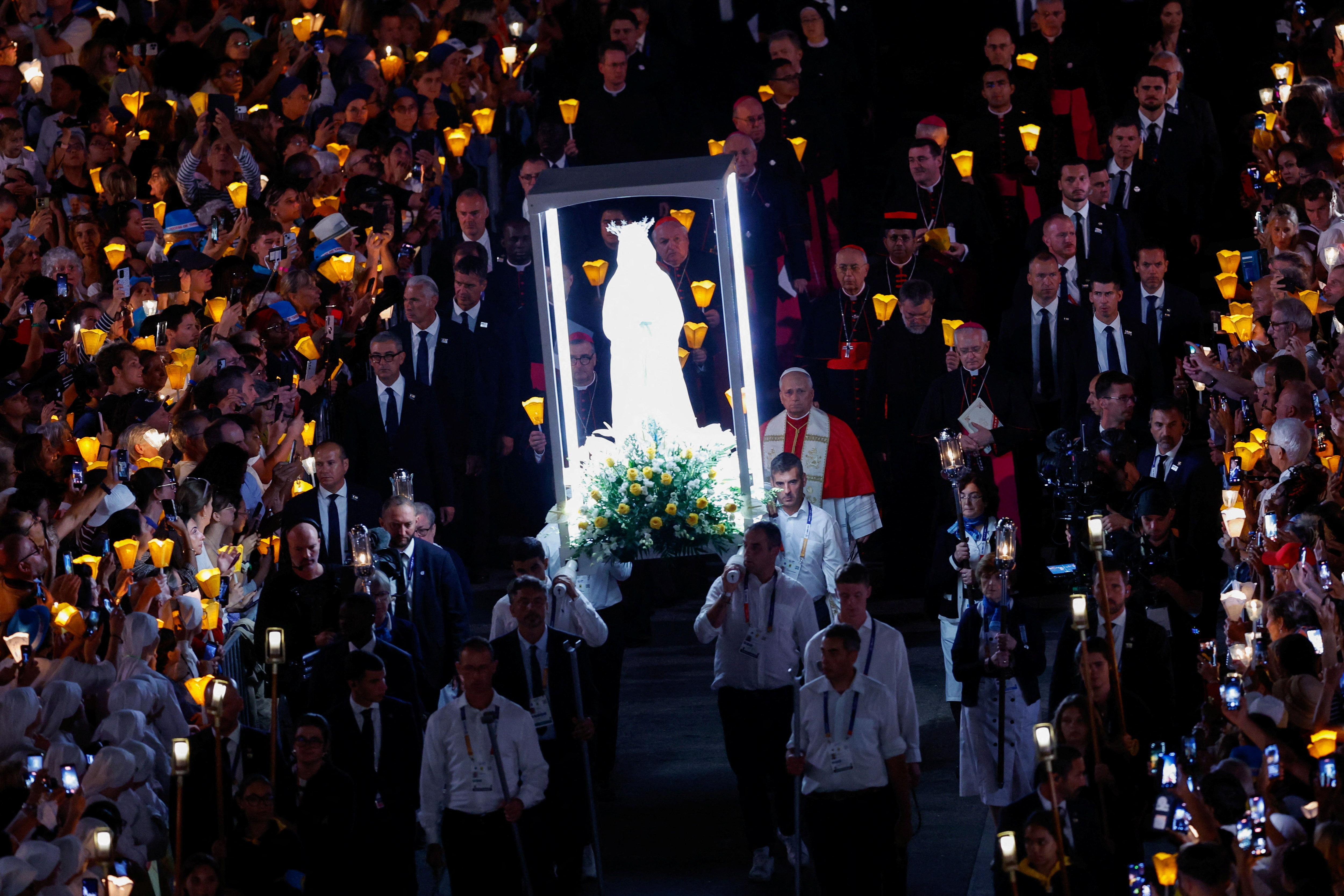 Pope Leo leads a candlelight procession at the Sanctuary of Our Lady of Lourdes, as part of his four-day apostolic journey to France, in Lourdes, France September 27, 2026 [Remo Casilli/Reuters]