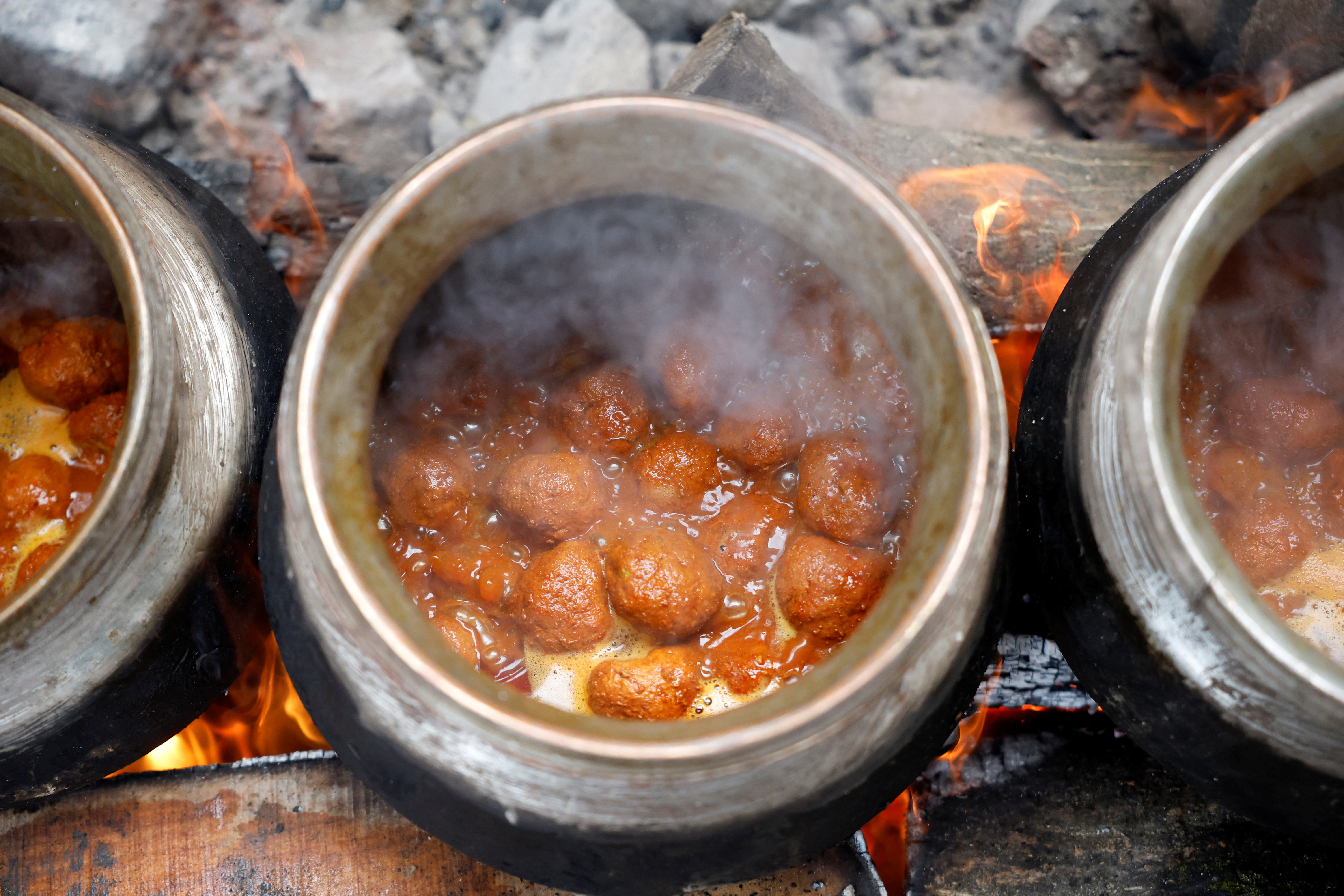 Meat is still pounded by hand and slow-cooked over wood fires, giving Wazwan its distinct texture and smoky flavour.
