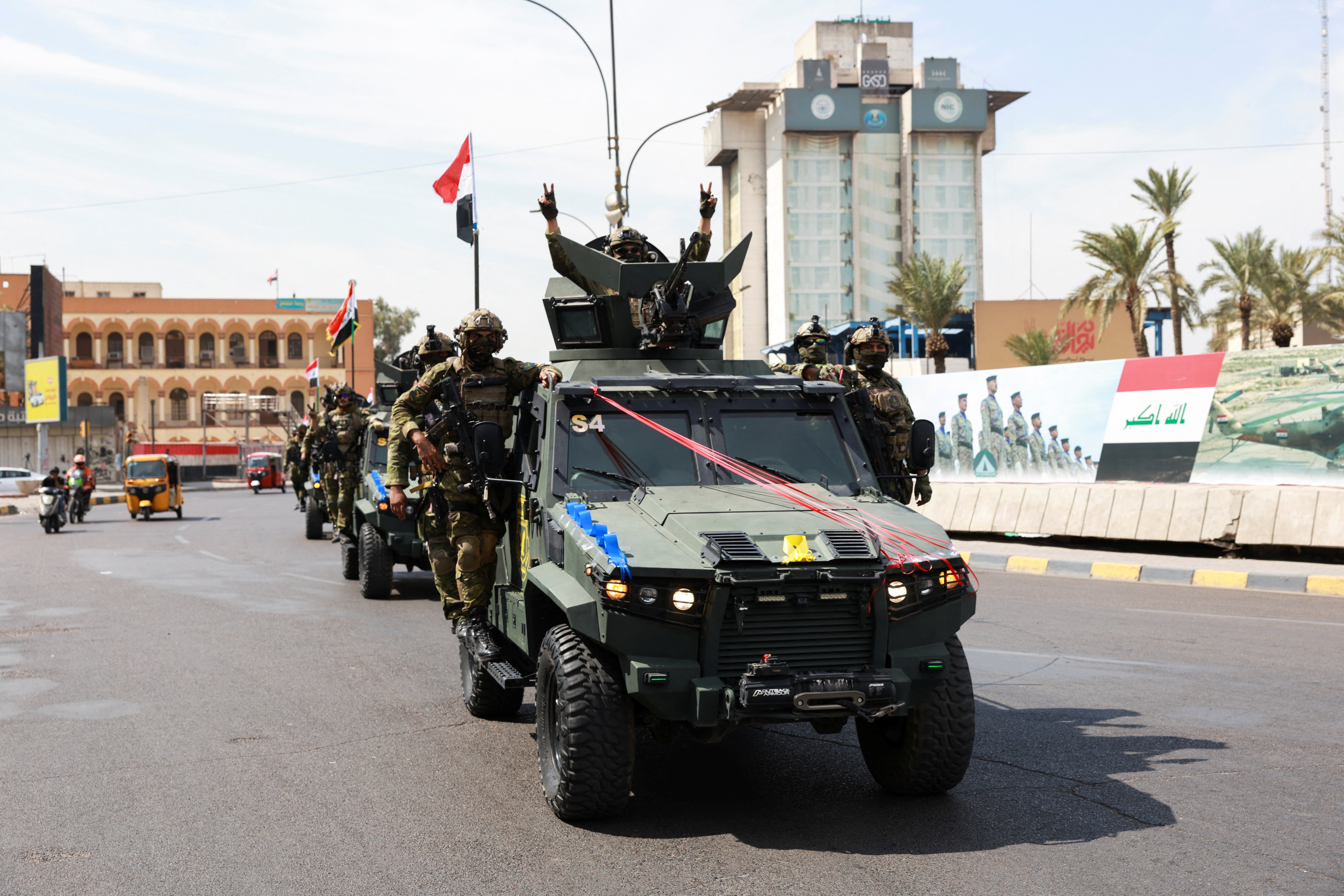 Members of the Iraqi security forces drive in a convoy through Baghdad to celebrate the withdrawal of US-led coalition forces from Iraq September 30, 2026 [Ahmed Saad/Reuters]