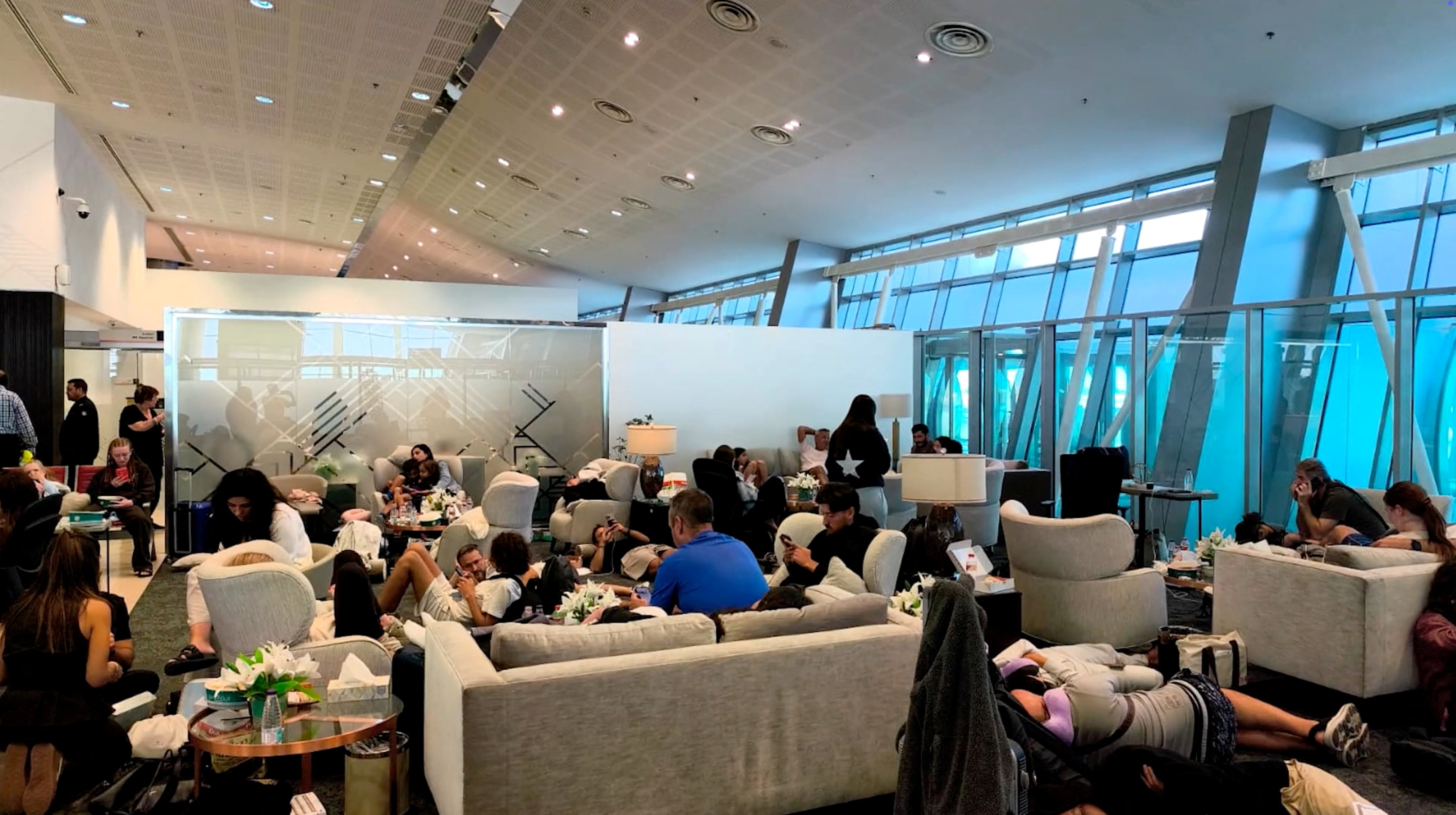 Passengers at Tabuk airport after a Flydubai aircraft that was bound for Israel from the United Arab Emirates was diverted to Saudi Arabia after transmitting emergency signals, in Tabuk, Saudi Arabia [Reuters]