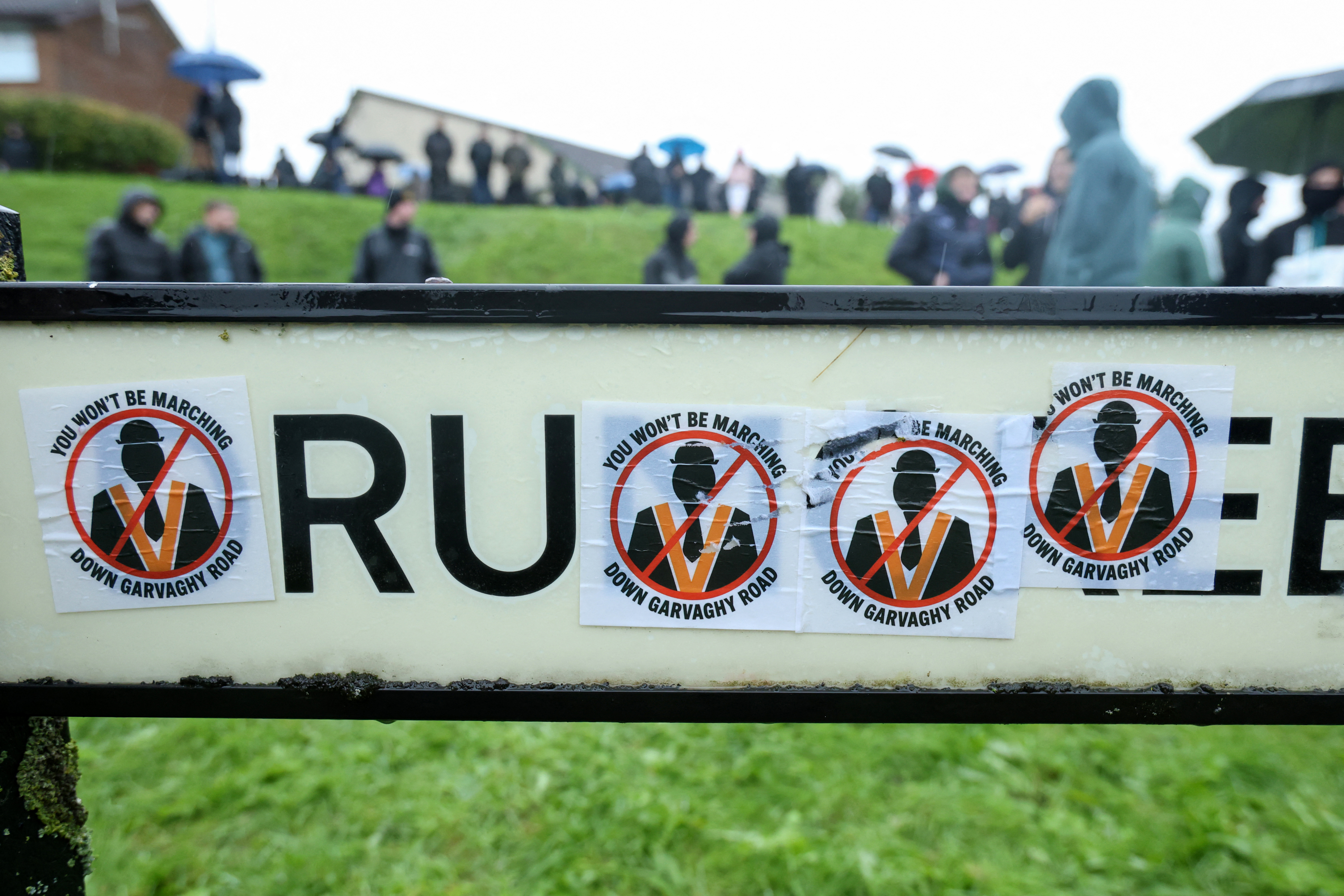 Northern Ireland protesters block Catholic area before Orange Order march