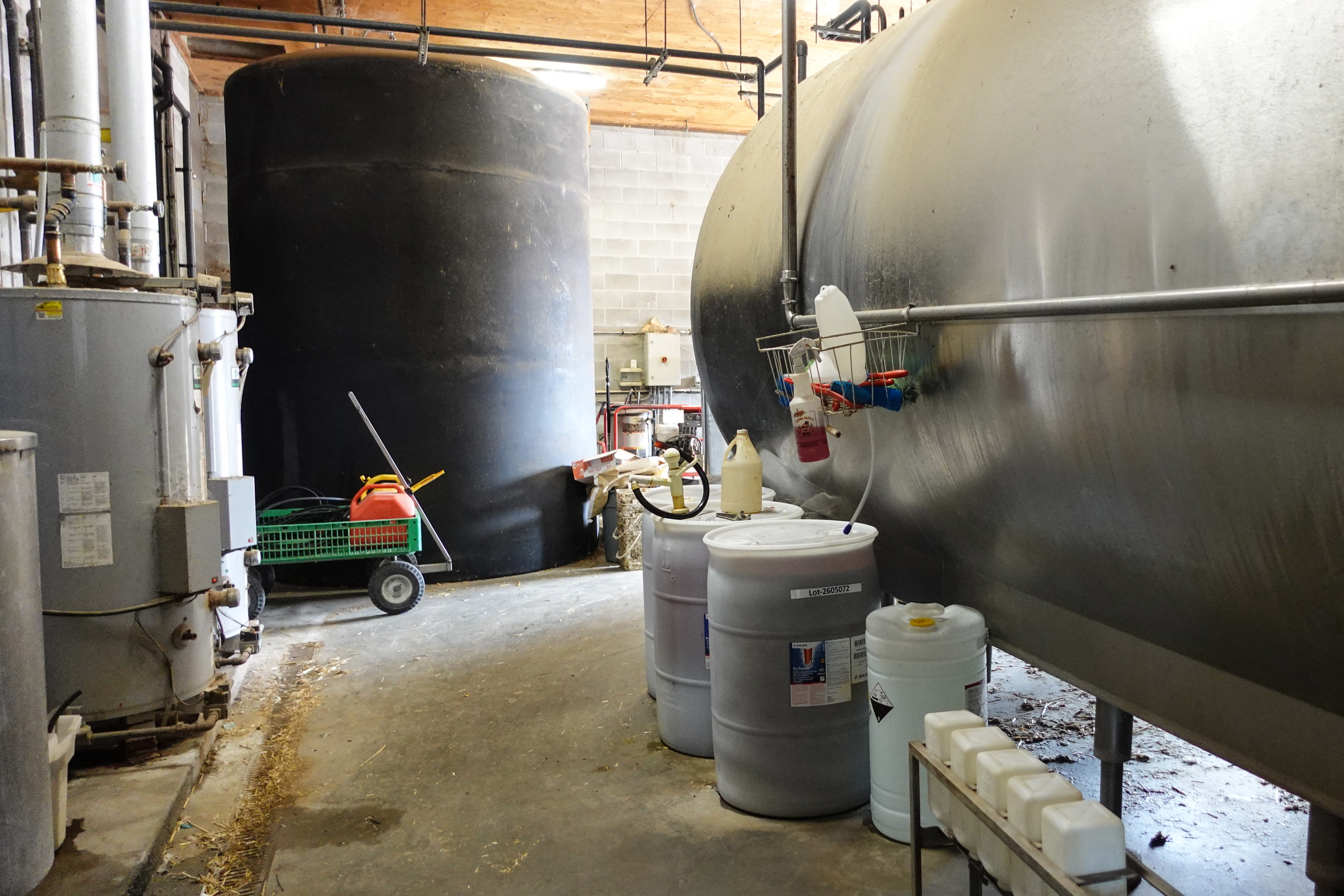 Each day almost 14,000 litres of milk produced by cows is stored in the refrigeration unit at Casey Pruim's Prime Acres Ltd. dairy farm in Abbotsford, British Columbia at a temperature of 2.8'C [Ali Mustafa/Al Jazeera]