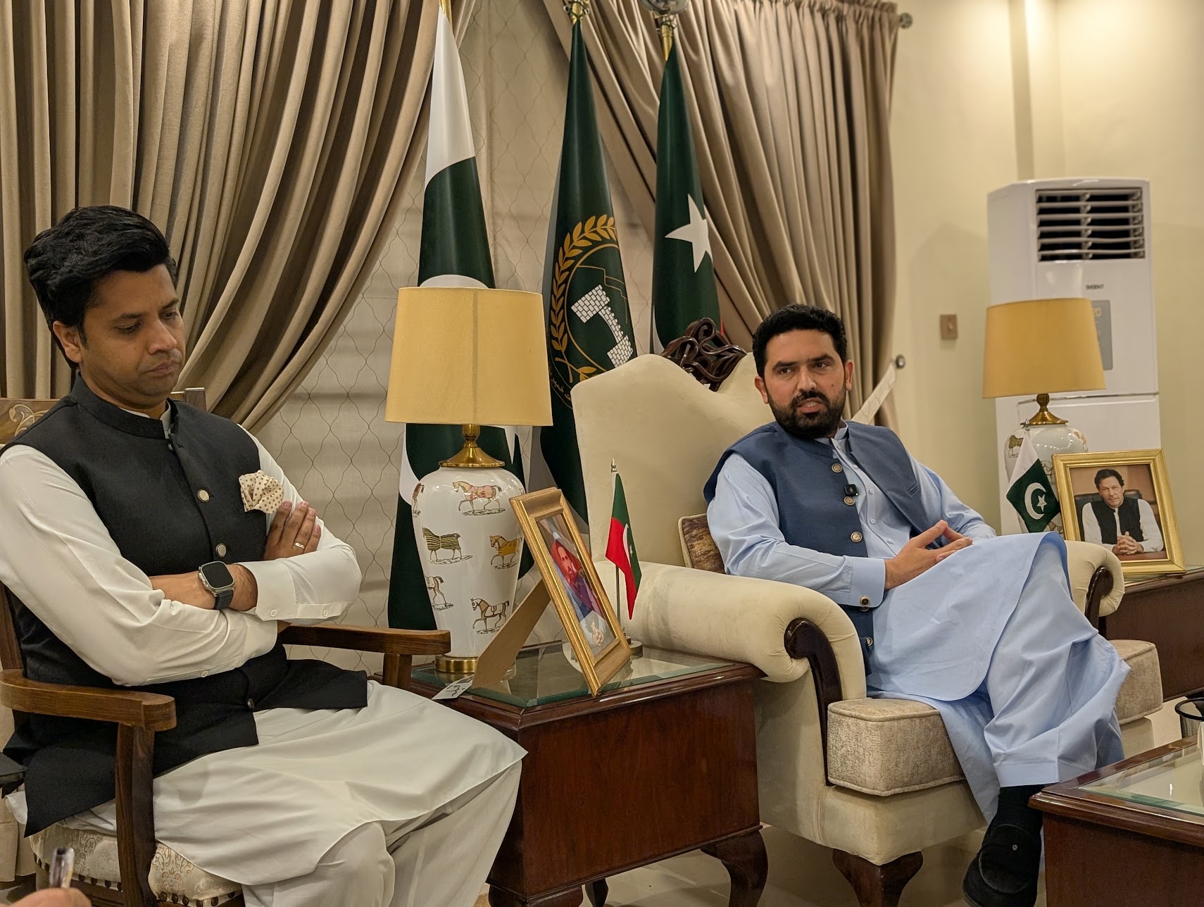 Sohail Afridi speaking at Islamabad's Khyber Pakhtunkwa House during a meeting with journalists on May 14, 2026. Provincial information minister Shafi Jan is sitting on Afridi's right. [Abid Hussain/Al Jazeera]