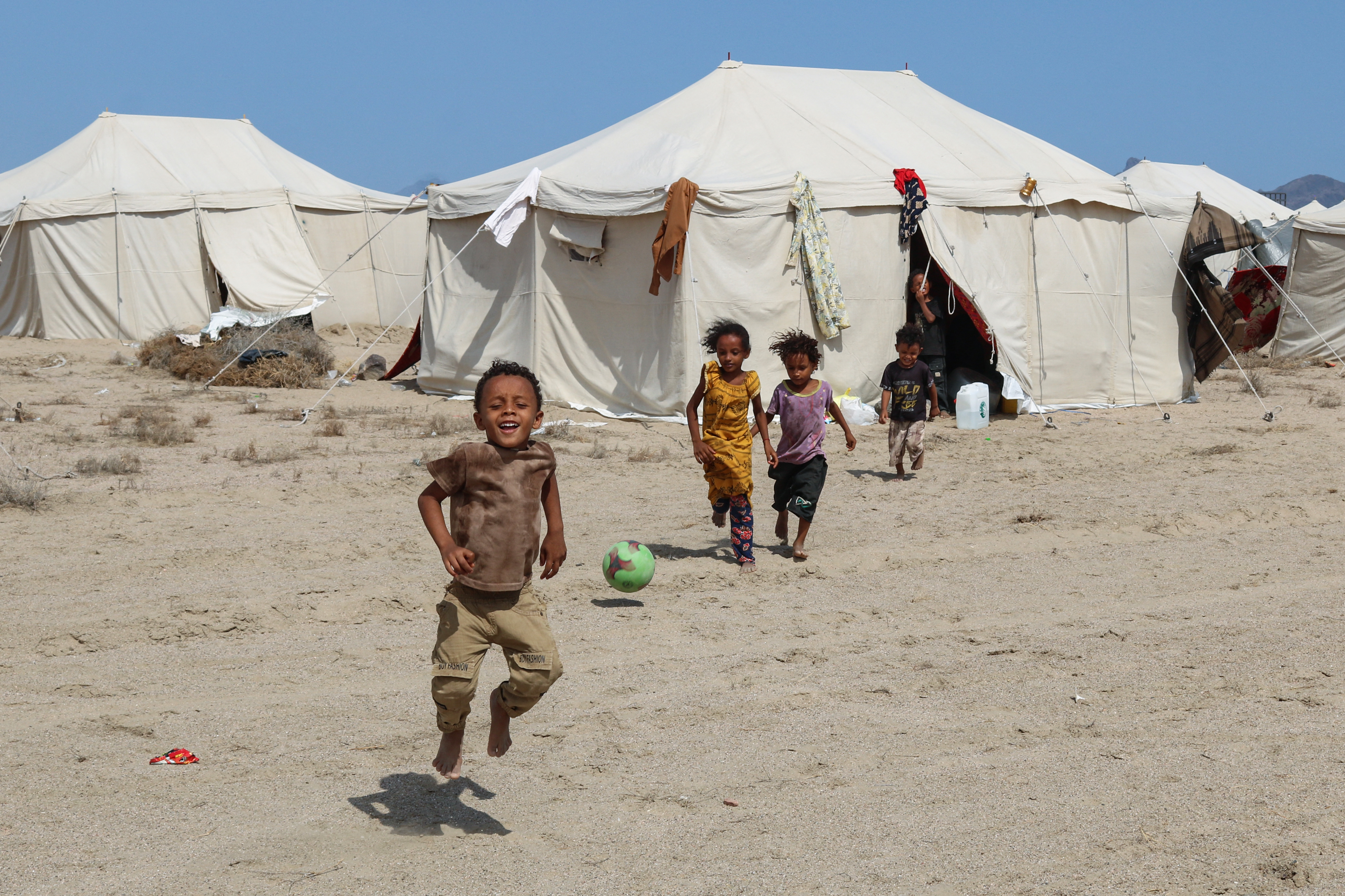 Children are seen at Al-Farsi camp for internally displaced people (IDPs) in Ras Imran on the outskirts of Al-Buraiqah district in southwest Aden in southern Yemen on September 17, 2026.