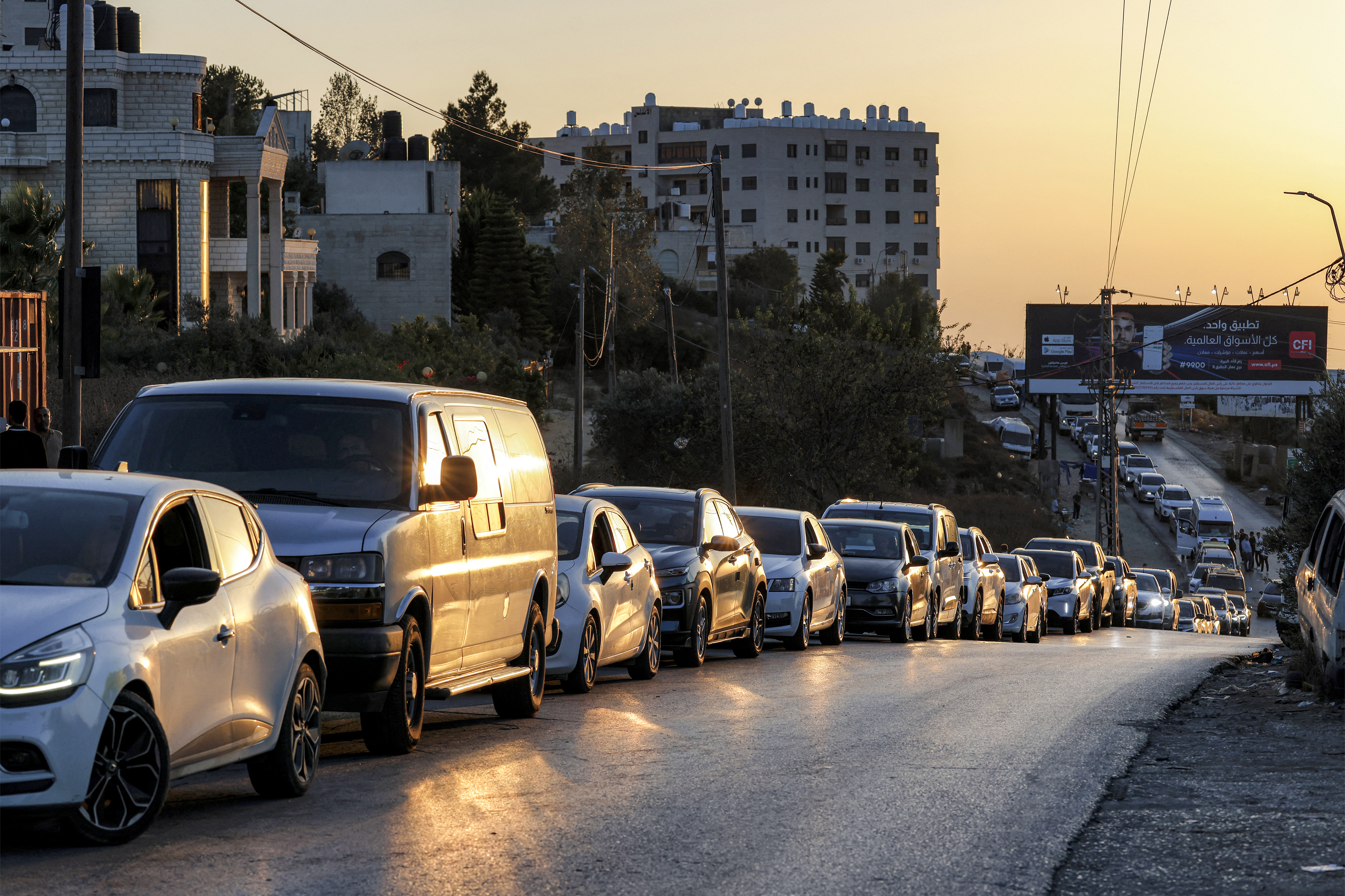 Commuters wait in their vehicles at the Israeli Atara checkpoint on Route 465 near Ramallah in the Israeli-occupied West Bank on September 27, 2026. (Photo by Zain JAAFAR / AFP)