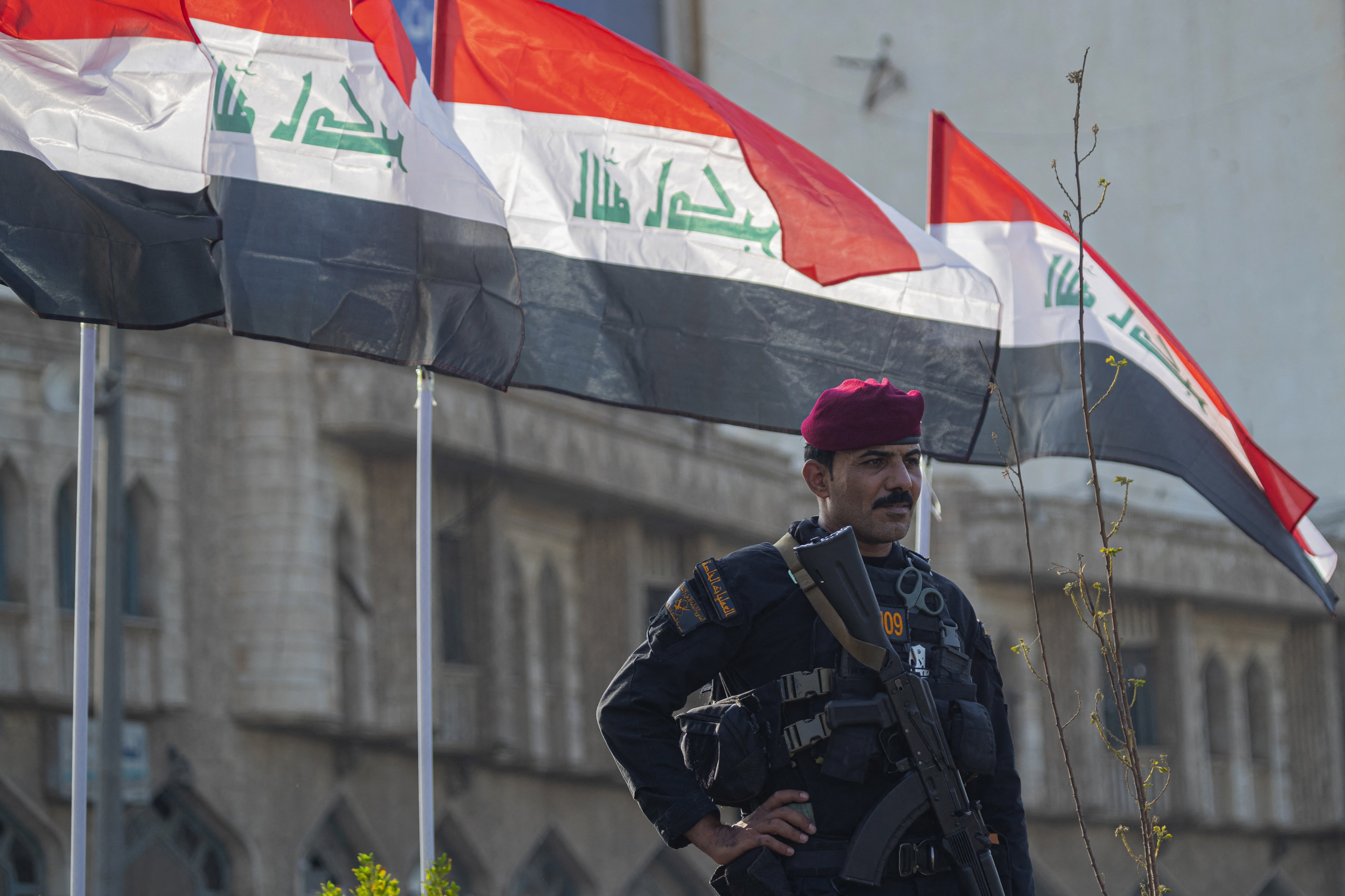 A security personnel stands guard at the Tahrir Square in Baghdad on September 26, 2026, during a gathering to mark the second anniversary of killing of Hezbollah's former chief Hassan Nasrallah, in a major strike by Israel on Beirut's southern suburbs of Lebanon.