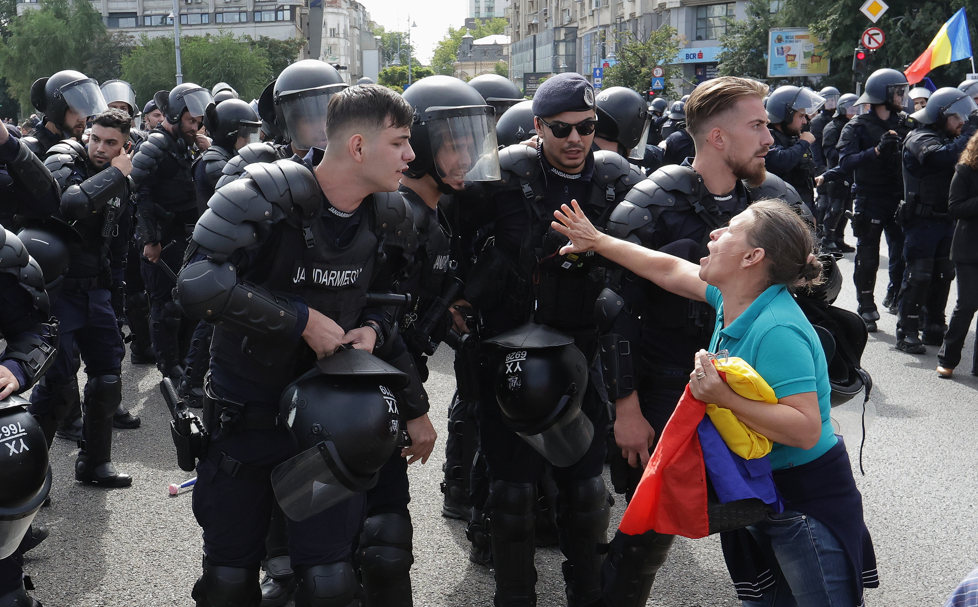 epaselect epa13241554 A Romanian protetster argues with riot-police officers during a protest held in front of the Romanian government headquarters in Bucharest, Romania, 15 September 2026. Thousands of shepherds from across the country gathered in the capital, unhappy with the extension of the ban on live sheep exports until 31 December 2026 — a decision by the European Commission prompted by outbreaks of Peste des Petits Ruminants (PPR) and sheep and goat pox, and attributed to insufficient preventive measures by the authorities. Farmers in the crop sector, who had been promised compensation of 100 euros per hectare for drought-affected crops, are also protesting because they will ultimately receive only 19 euros per hectare, an amount that fails to cover the losses caused by the extreme and prolonged drought. EPA/Robert Ghement