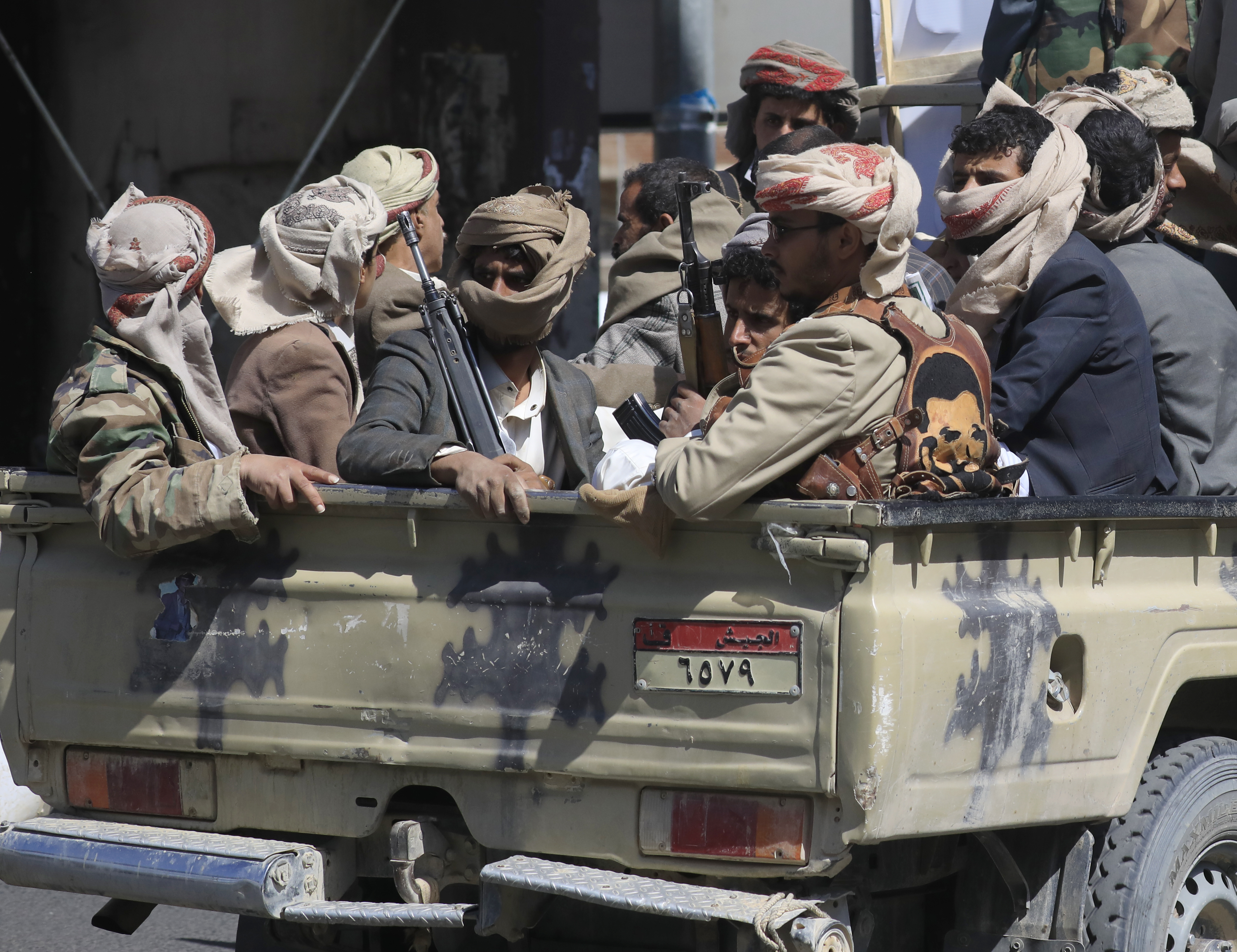 Houthi fighters ride in a pickup truck during a funeral procession for fellow fighters killed in recent fighting in Sanaa, Yemen, 24 September 2026. Yemen's Houthis have seized large stretches of Yemen's Red Sea coast following an offensive against Saudi-backed government forces, strengthening their position around the strategic Bab al-Mandeb Strait, which connects the Red Sea with the Gulf of Aden. [EPA/YAHYA ARHAB]