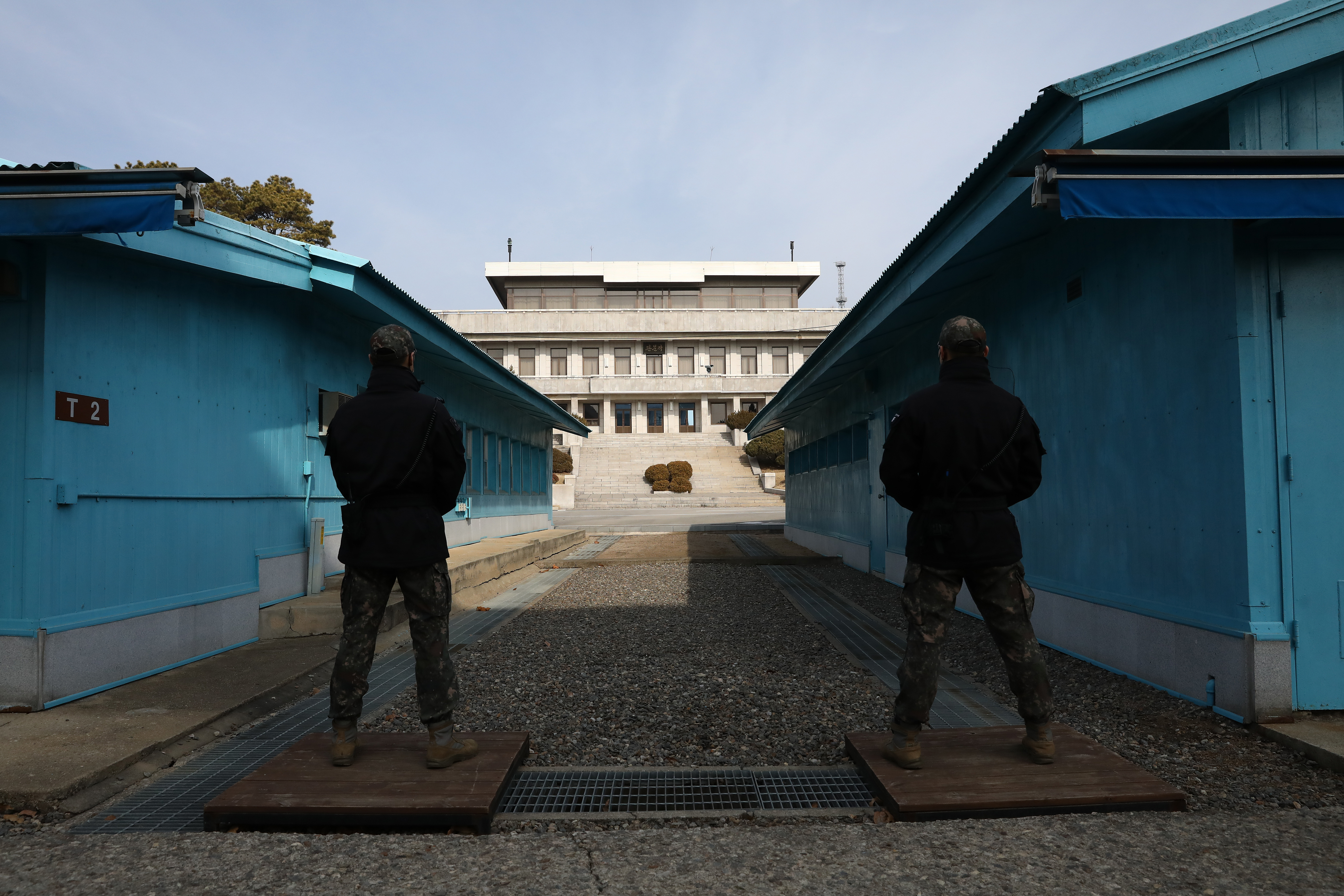 PANMUNJOM, SOUTH KOREA - FEBRUARY 07: South Korean soldiers stand guard in the truce village of Panmunjom inside the demilitarized zone (DMZ) separating South and North Korea on February 07, 2023 in Panmunjom, South Korea. North Korea has convened a meeting of the ruling party's central military commission to discuss ways to expand operational combat drills and "more strictly perfect" its readiness posture for war, according to its state media. North Korea is likely to hold a military parade this week to mark the 75th anniversary of the founding of its armed forces in a bid to flex its military muscle. (Photo by Chung Sung-Jun/Getty Images)
