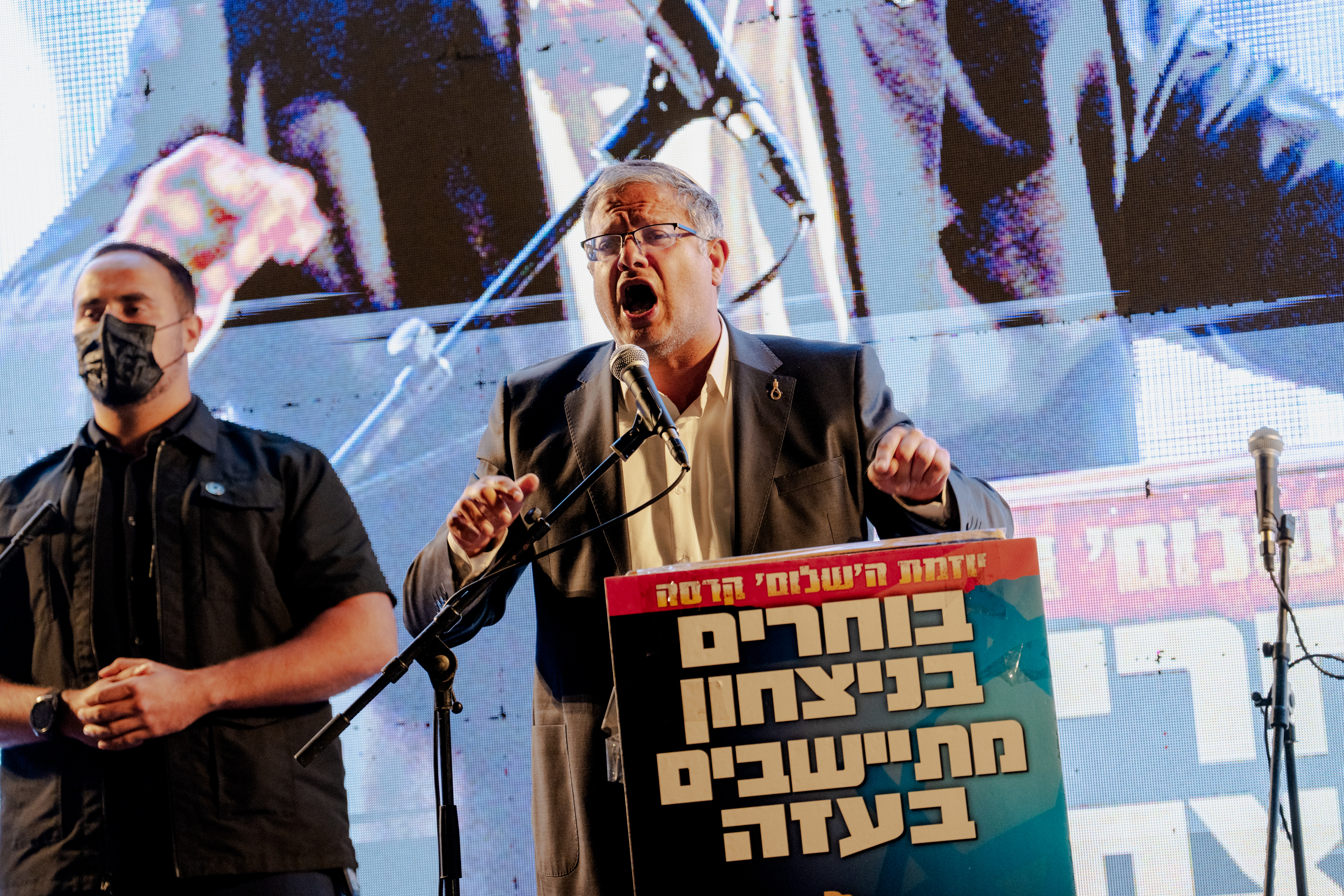 KIBBUTZ NIR-AM, ISRAEL - SEPTEMBER 27: Israel's National Security Minister Itamar Ben-Gvir speaks passionately behind a podium reading in Hebrew "Choosing victory, settling in Gaza" during a Sukkot gathering outside Kibbutz Nir-Am on September 27, 2026 on the Israel-Gaza border. A group of Israeli right-wing activists from the Nahala settler movement, including Daniella Weiss, celebrated the Jewish holiday of Sukkot. Weiss is part of an Israeli settler movement that has stated its intention to repopulate the Gaza Strip with Israeli settlements. The last Israeli settlements in Gaza were dismantled and evacuated in 2005. (Photo by Erik Marmor/Getty Images)