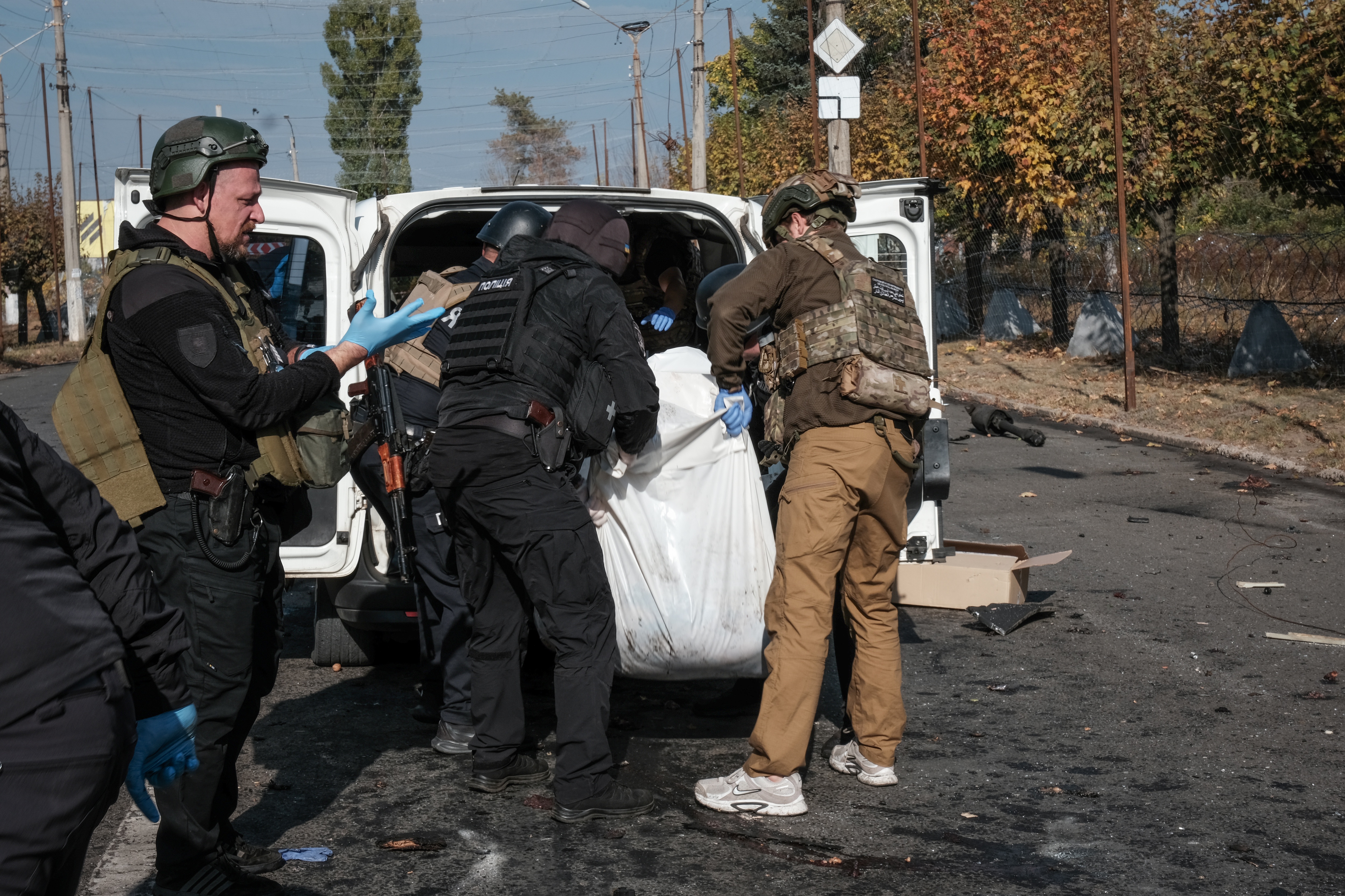 epa13289425 A covered body is retrieved at the scene following a Russian missile strike on a bus in the eastern city of Kramatorsk, Ukraine, 08 October 2026. Over 30 people were killed n one of the worst attacks by Russia on Ukrainian civilians this year, officials said on Thursday. EPA/MARIA SENOVILLA