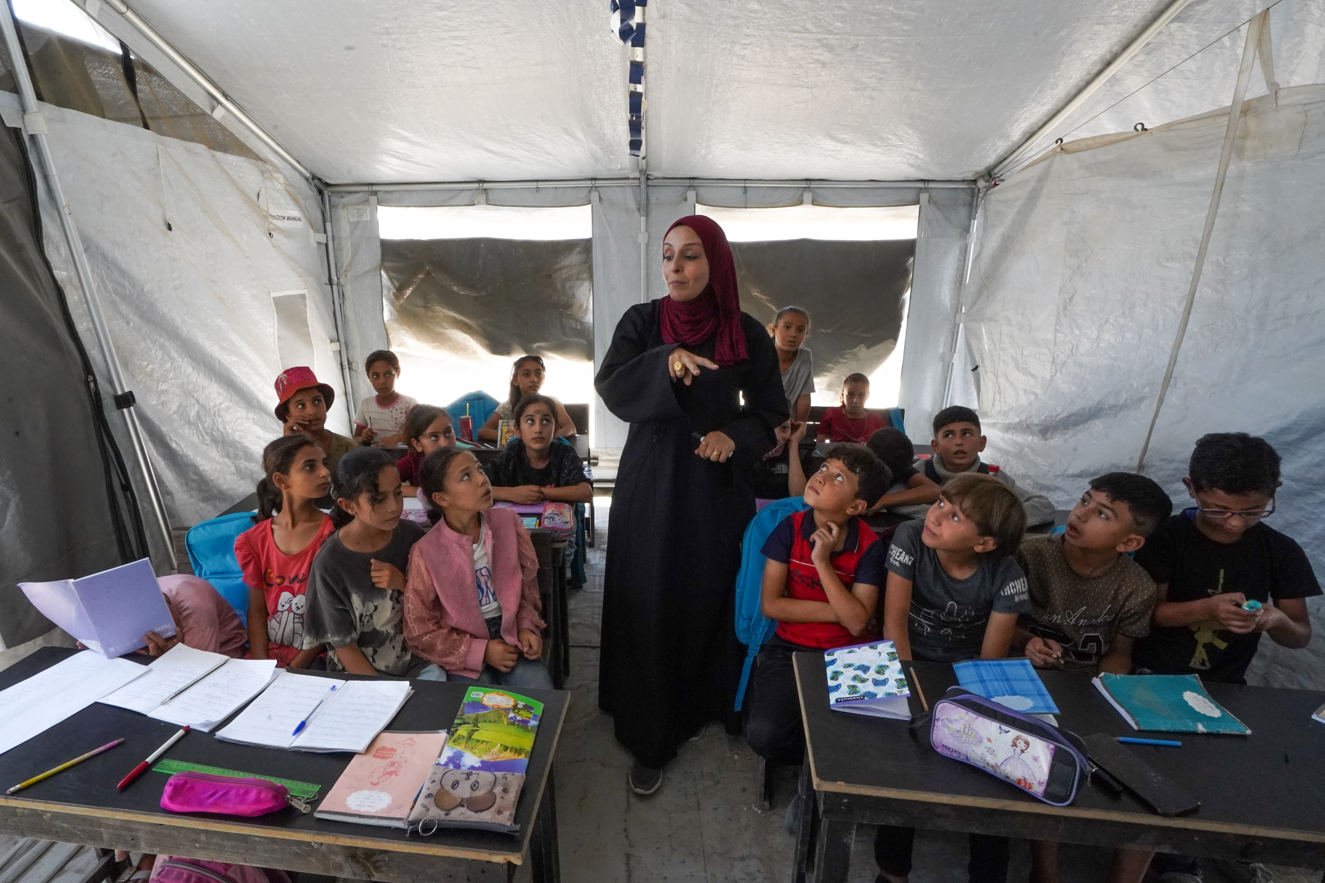 Teacher Falasteen Hussein: “The tent represents an attempt to hold on to what remains of my profession, rebuild my dream and preserve my source of income, even with the most basic resources.” October 6, 2026 [Iyad Al-Qatrawi/Al Jazeera]