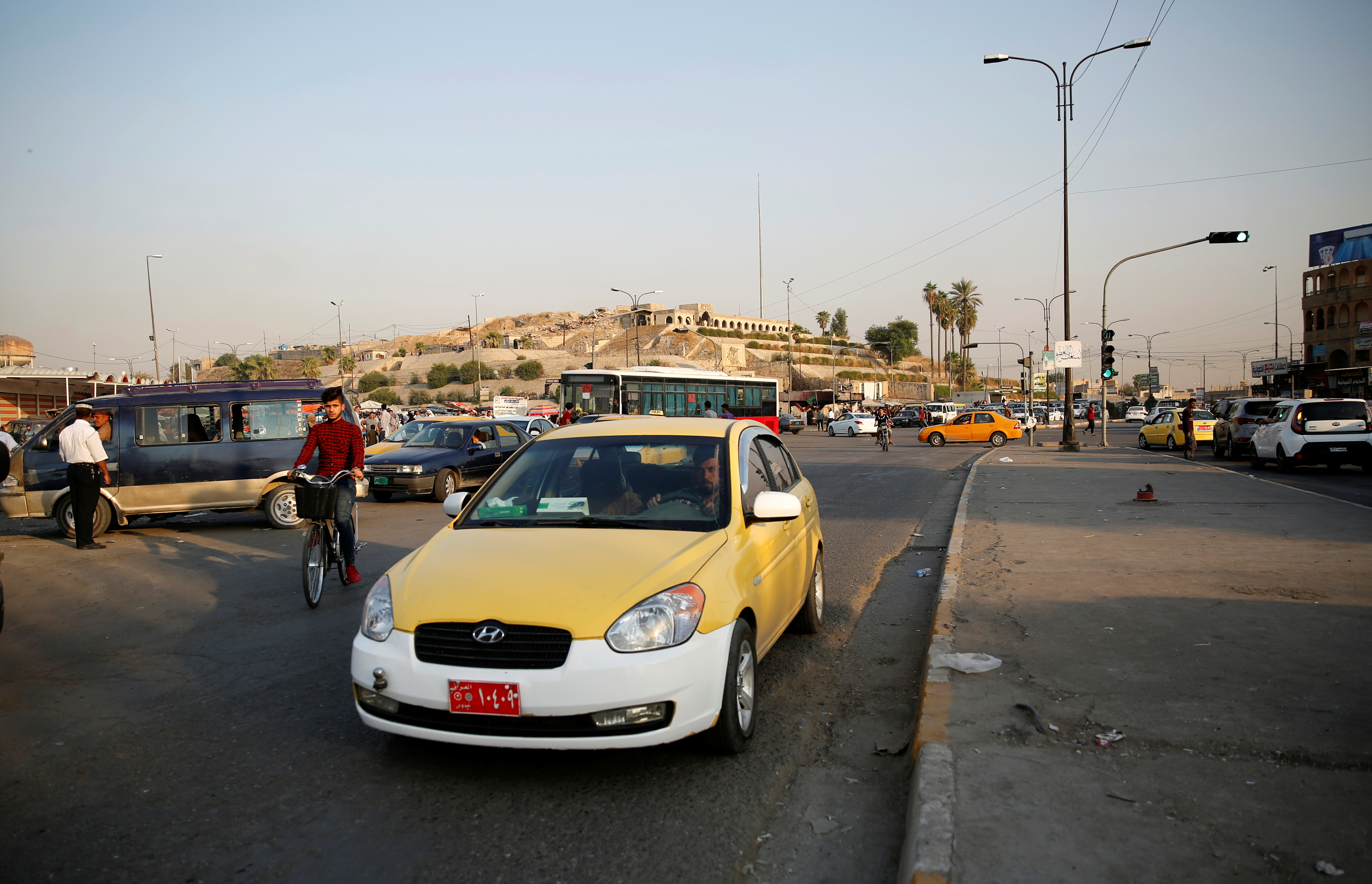A man drives a Careem taxi car in Mosul, Iraq September 26, 2019. REUTERS/Abdullah Rashid