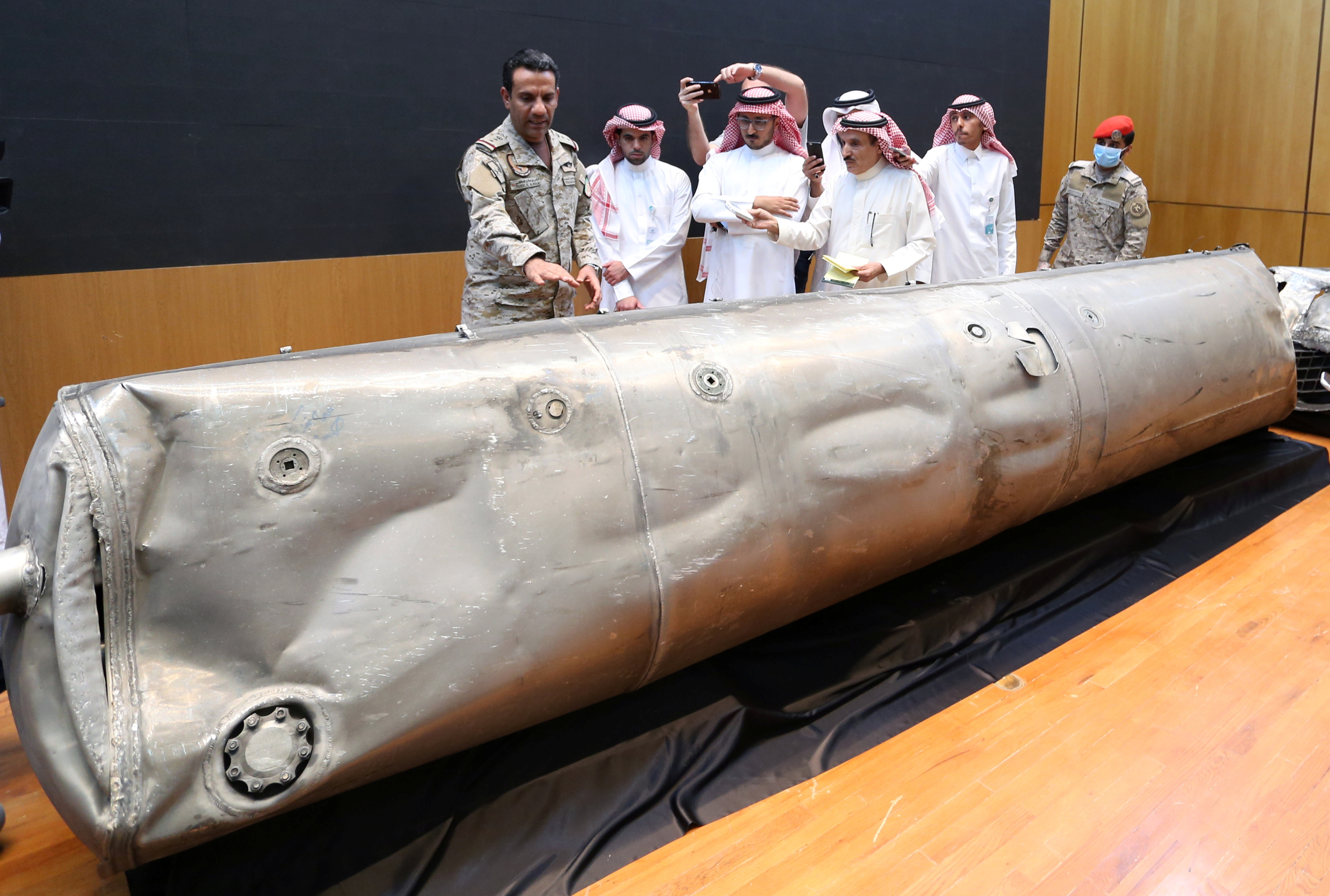 Saudi-led coalition spokesman, Colonel Turki al-Malki, displays the debris of a ballistic missile which he says was launched by Yemen's Houthi group towards the capital Riyadh, during a news conference in Riyadh, Saudi Arabia March 29, 2020.