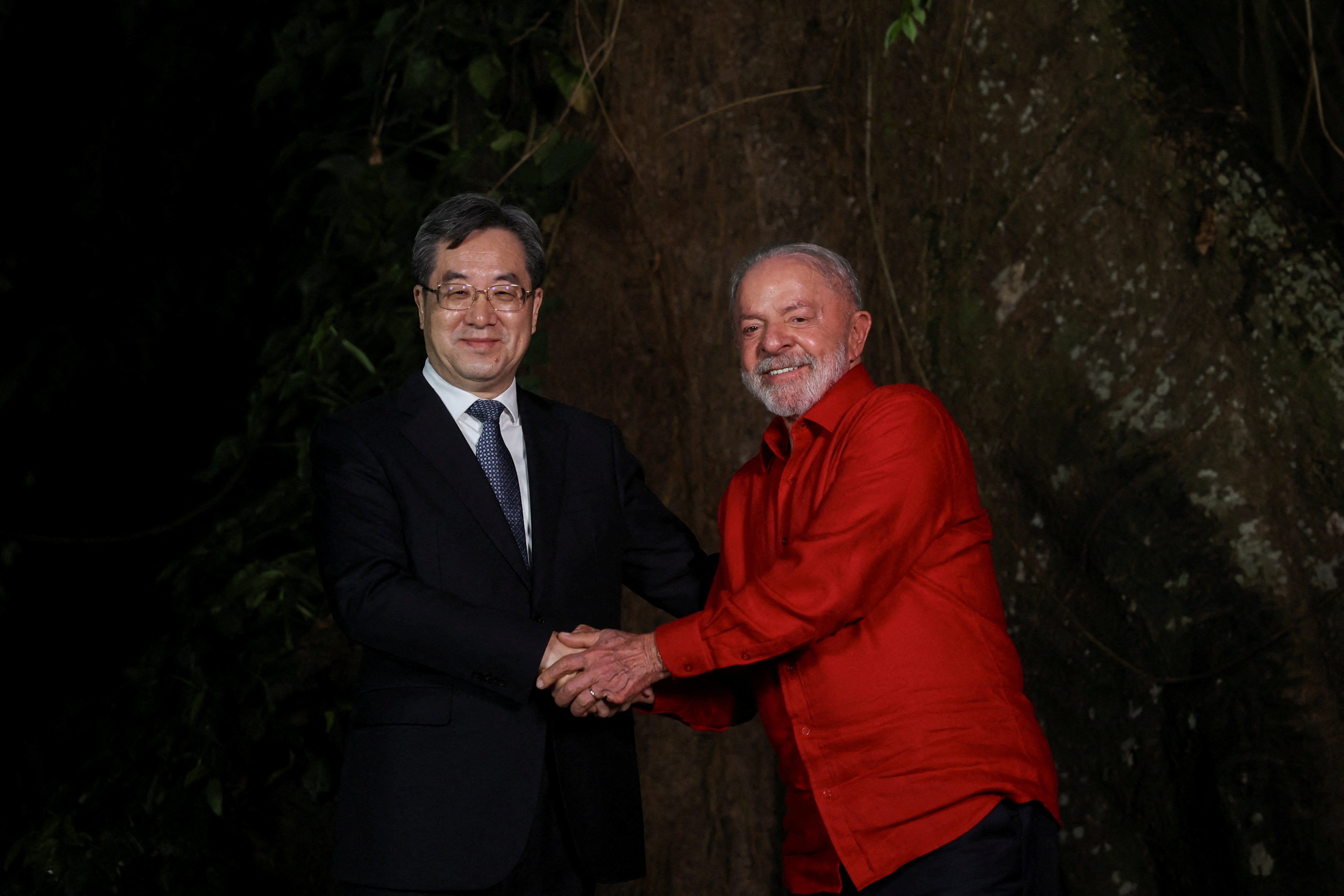 Brazil's President Luiz Inacio Lula da Silva shakes hands with China's Vice Premier Ding Xuexiang, ahead of the United Nations Climate Change Conference (COP 30), in Belem, Brazil, November 5, 2025. REUTERS/Adriano Machado
