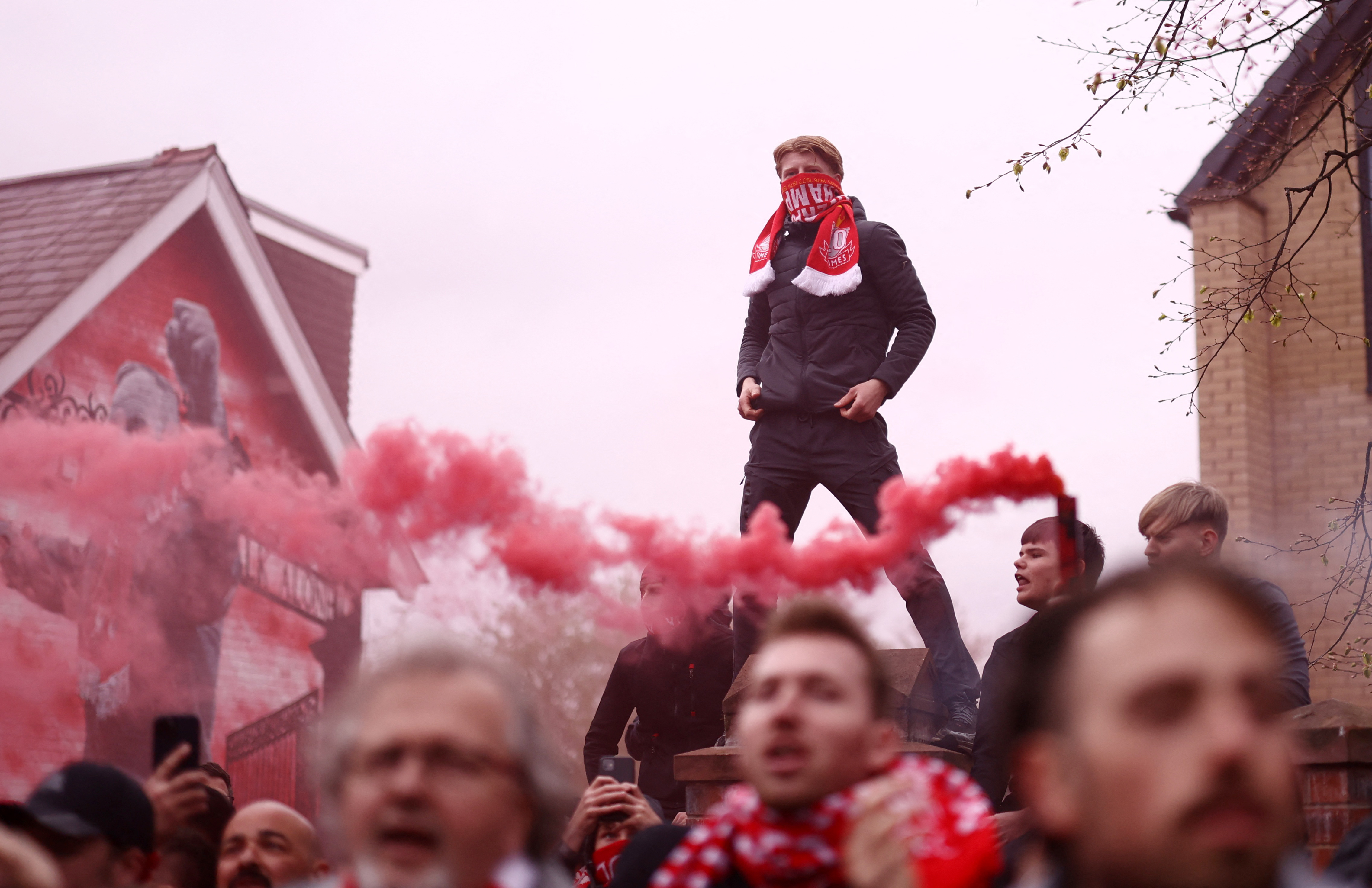 Soccer Football - UEFA Champions League - Quarter Final - Second Leg - Liverpool v Paris St Germain - Anfield, Liverpool, Britain - April 14, 2026 Liverpool fans with flares outside the stadium before the match Action Images via Reuters/Lee Smith