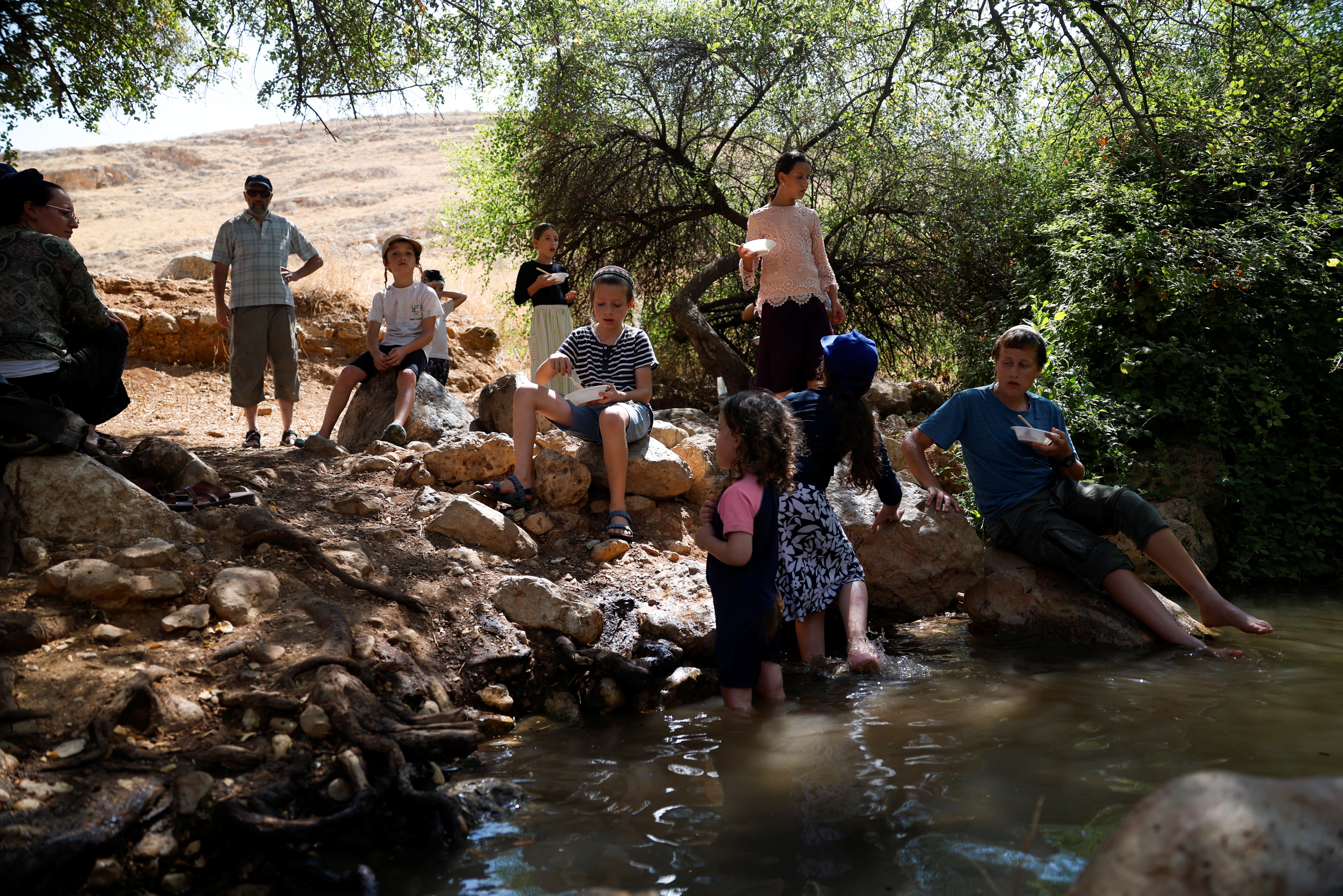 Israelis visit the Fasayil springs near the Palestinian village Fasayil, where residents say that Israeli settlers diverted water from the spring causing crops to die, in the Israeli-occupied West Bank, August 9, 2026. REUTERS/Mohamad Torokman