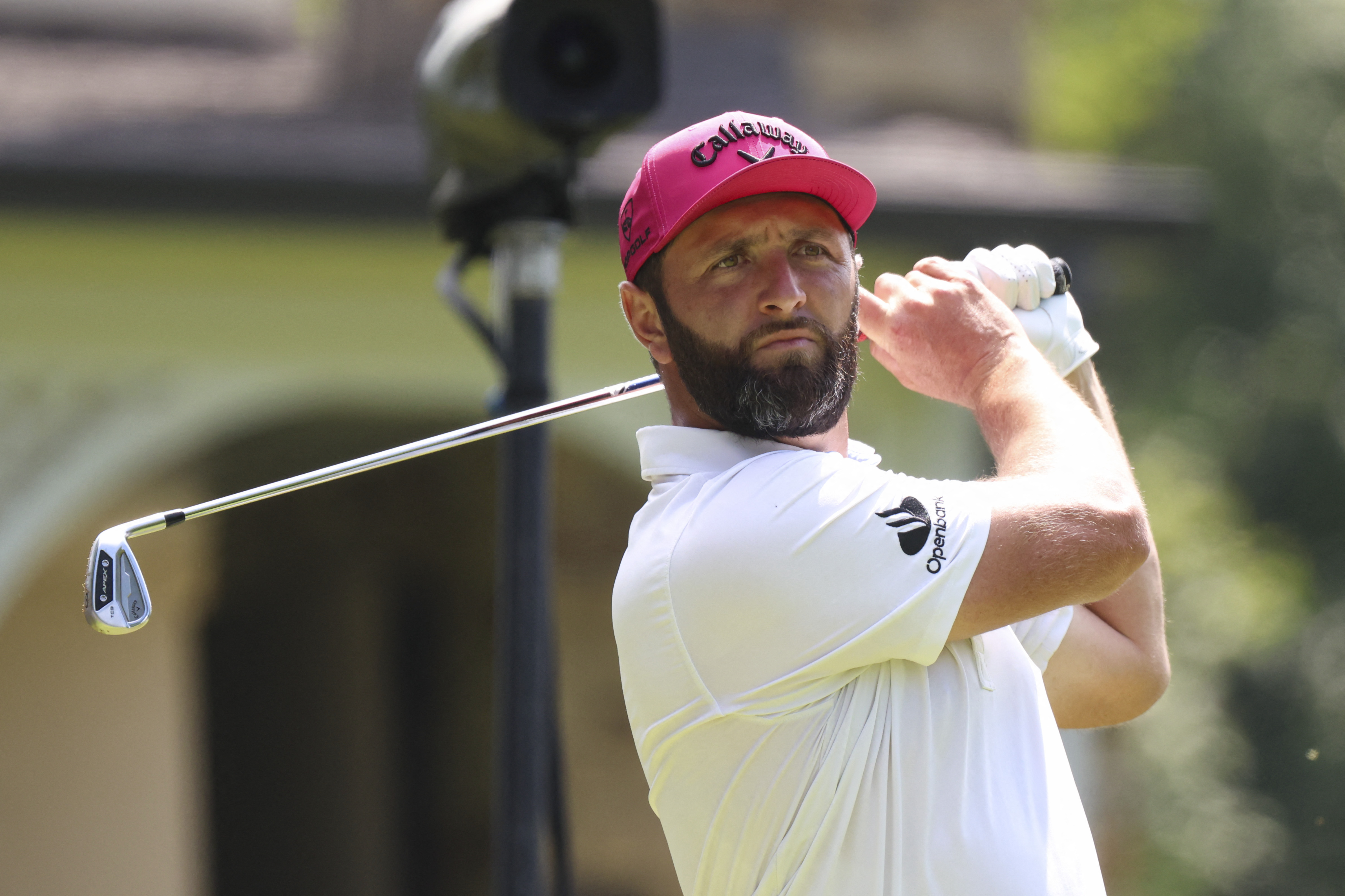 Jon Rahm tees off on hole three.