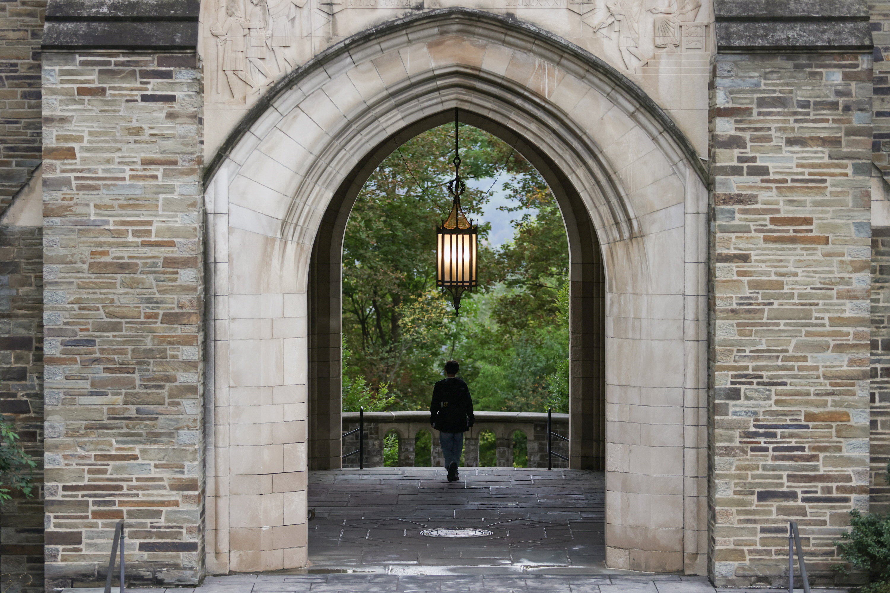 A student walks through an archway at Myron Taylor Hall on the Cornell University campus in Ithaca, New York, US, October 1, 2026. REUTERS/Lauren Petracca