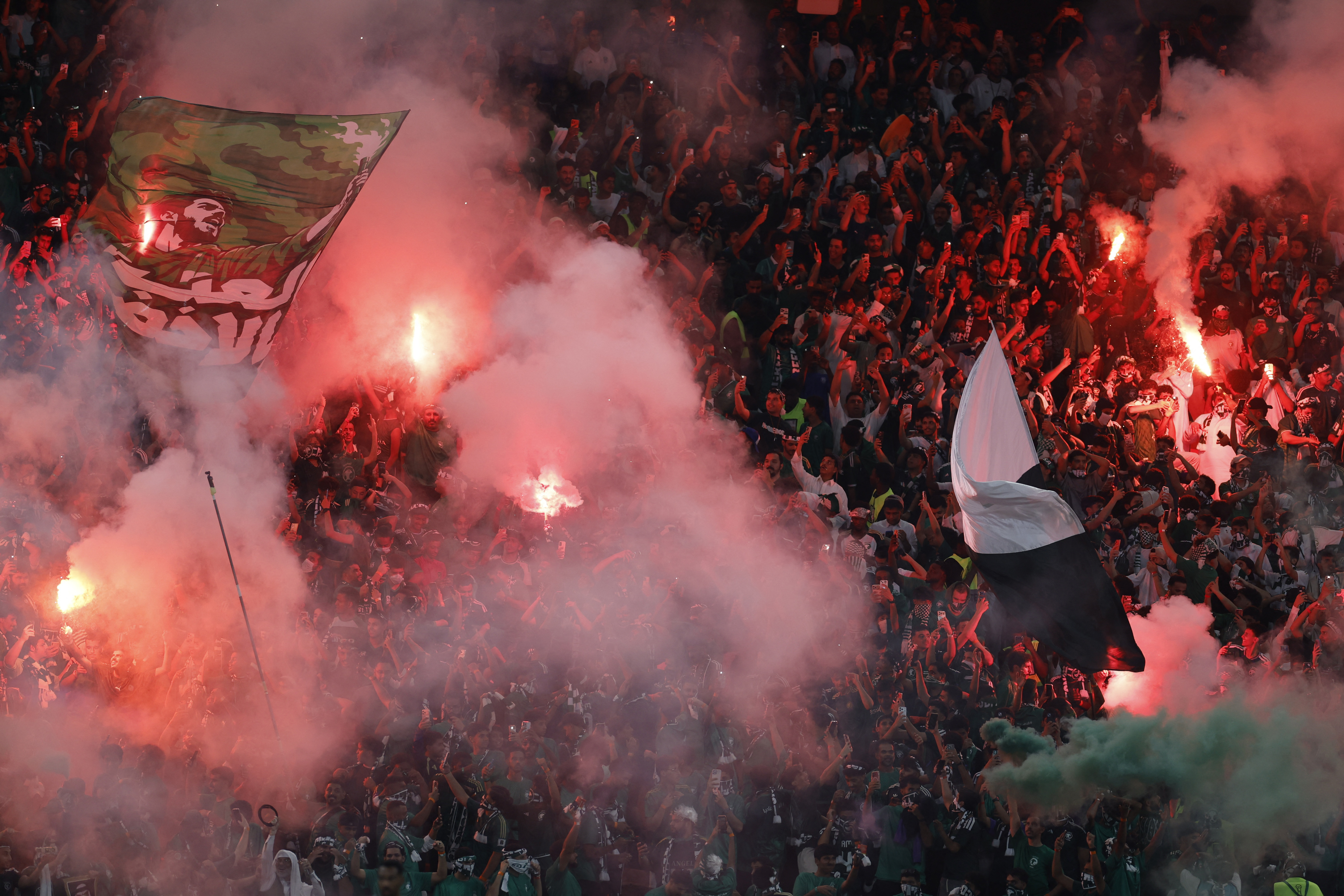 Soccer Football - Gulf Cup - Final - Saudi Arabia v United Arab Emirates - King Abdullah Sports City Stadium, Jeddah, Saudi Arabia - October 6, 2026 Saudi Arabia fans celebrate with flares after winning the Gulf Cup