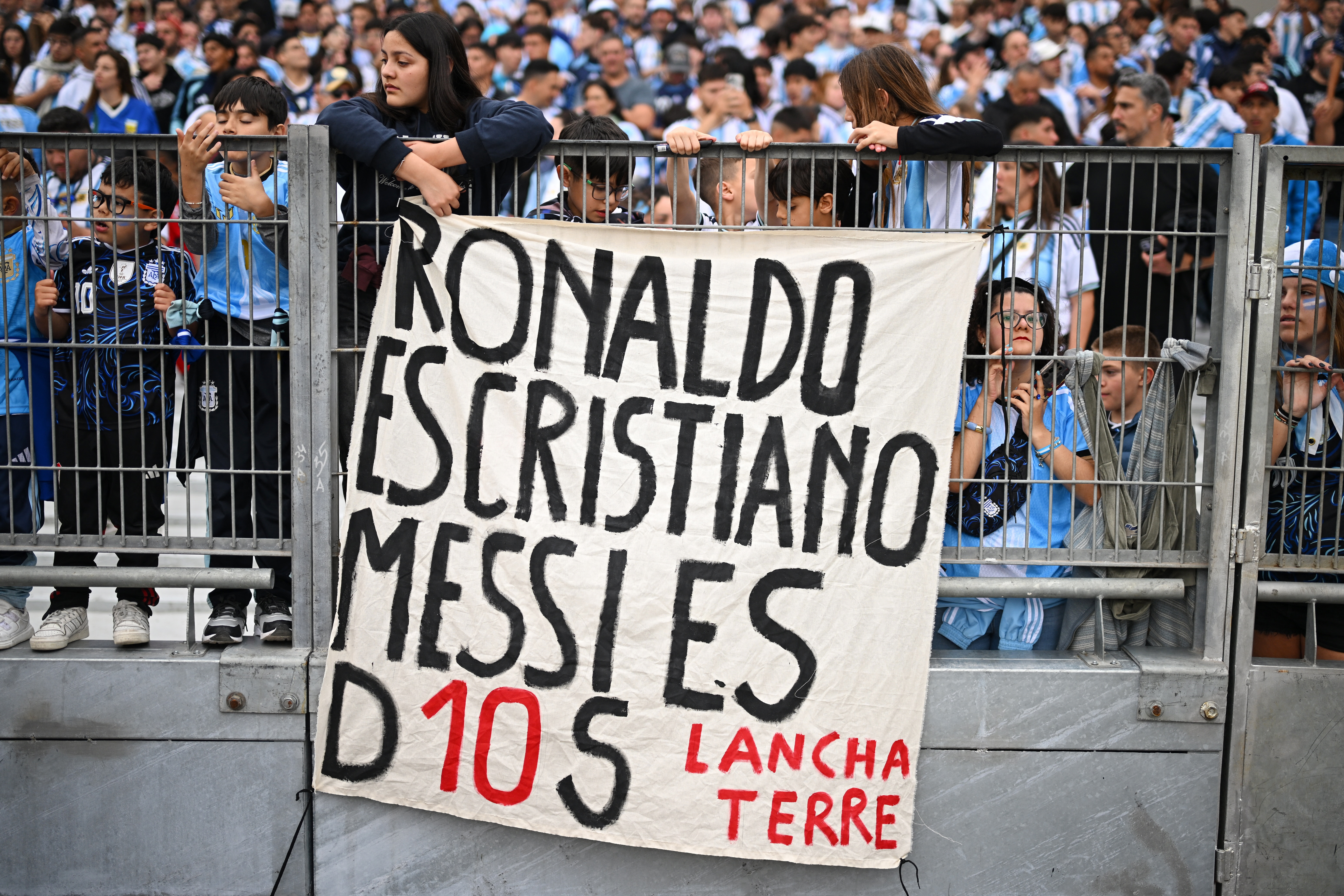 Soccer Football - International Friendly - Argentina v Benin - Estadio Monumental, Buenos Aires, Argentina - October 6, 2026 Argentina fans in the stands display a flag that reads, "Ronaldo is Cristiano (Christian), but (Lionel) Messi is God." REUTERS/Rodrigo Valle