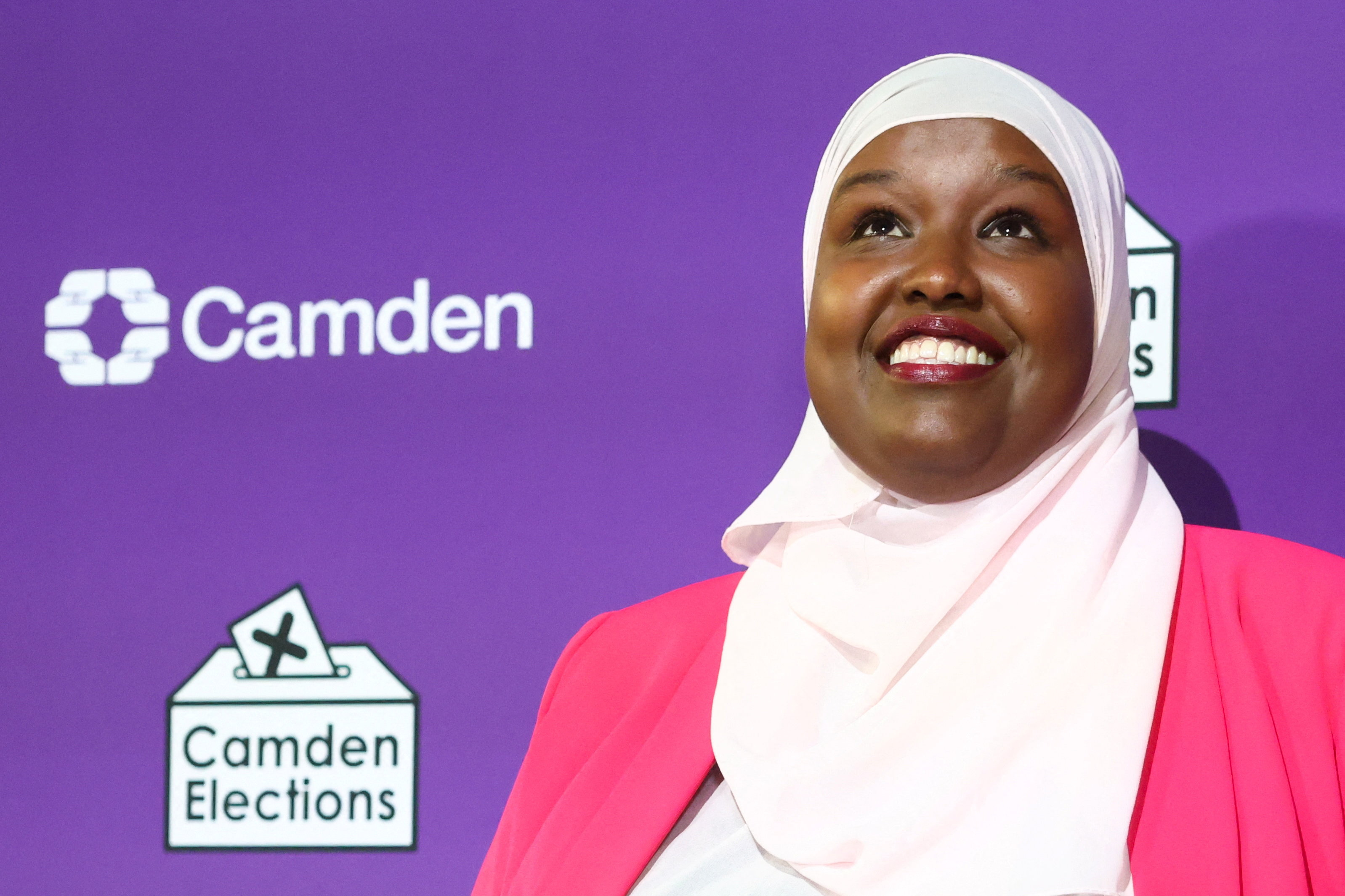 Labour candidate Sagal Abdi-Wali smiles in front of the elections sign.