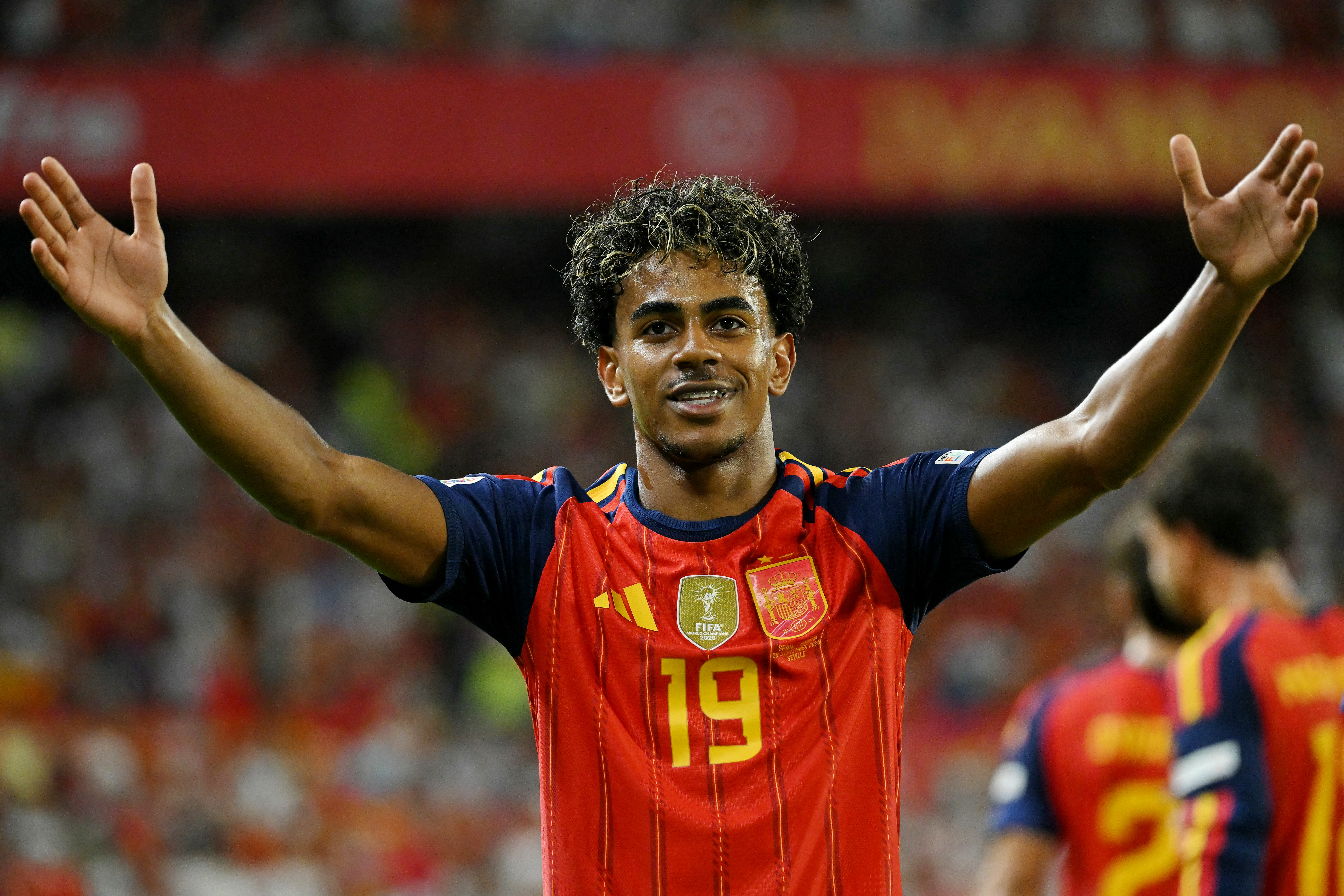 Spain's forward #19 Lamine Yamal celebrates on the field.