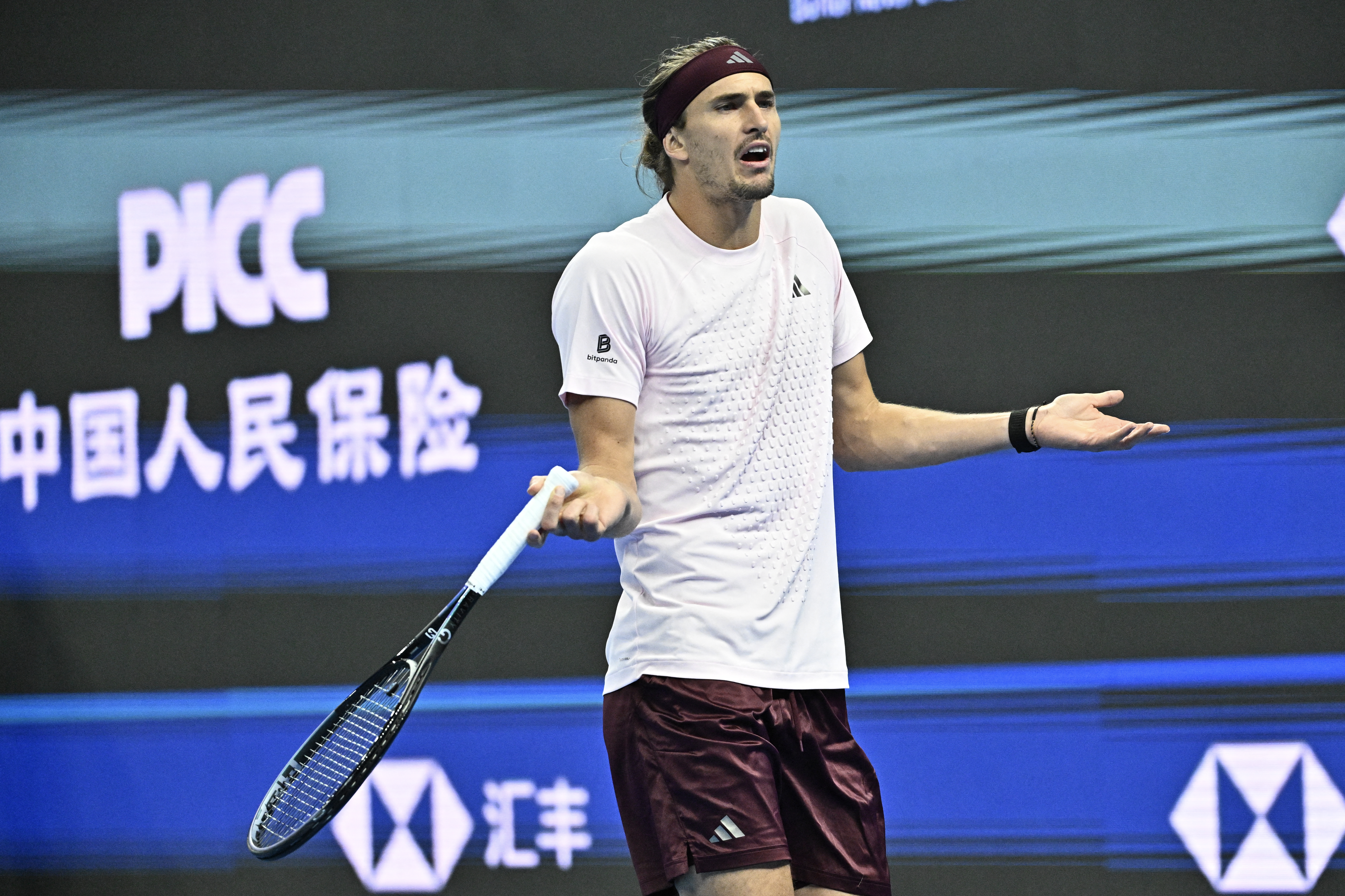 Germanys Alexander Zverev reacts during his mens singles quarter-final match against Serbia's Novak Djokovic at the China Open tennis tournament in Beijing on October 4, 2026. (Photo by Pedro PARDO / AFP)