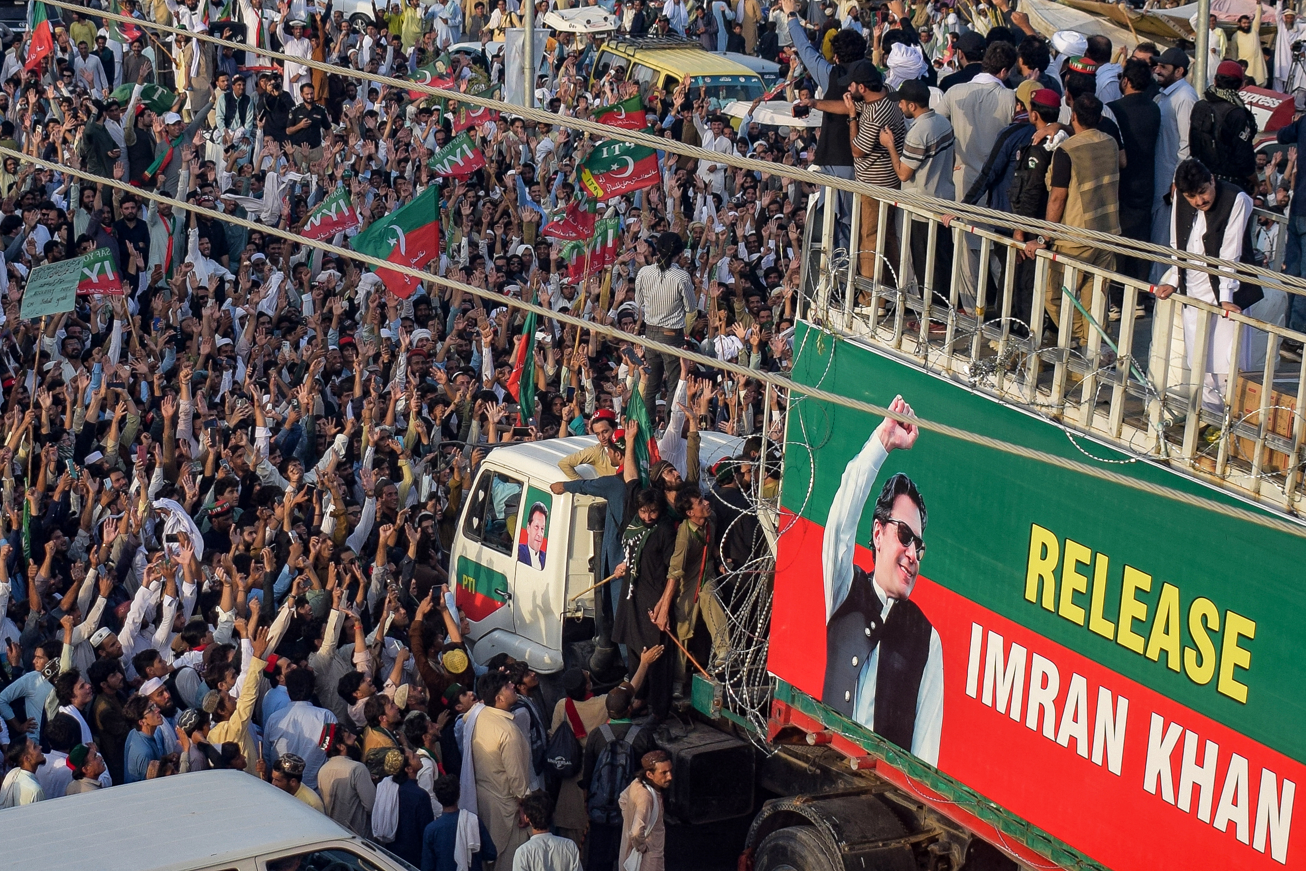 Supporters of jailed former prime minister Imran Khan's Pakistan Tehreek-e-Insaf (PTI) party take part in a long march in Lakki Marwat of Pakistan's Khyber Pakhtunkhwa province on October 4, 2026 [Marwat Akbar/AFP]