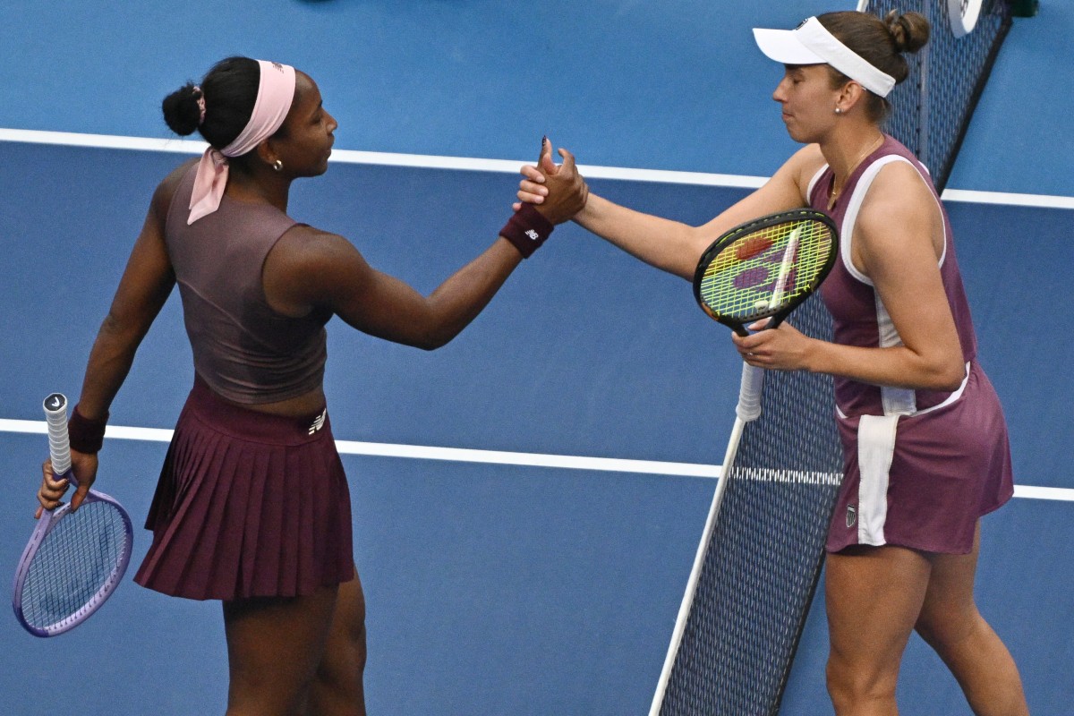 Belgium's Elise Mertens (R) shakes hands with USA's Coco Gauff after their women's singles match at the China Open tennis tournament in Beijing