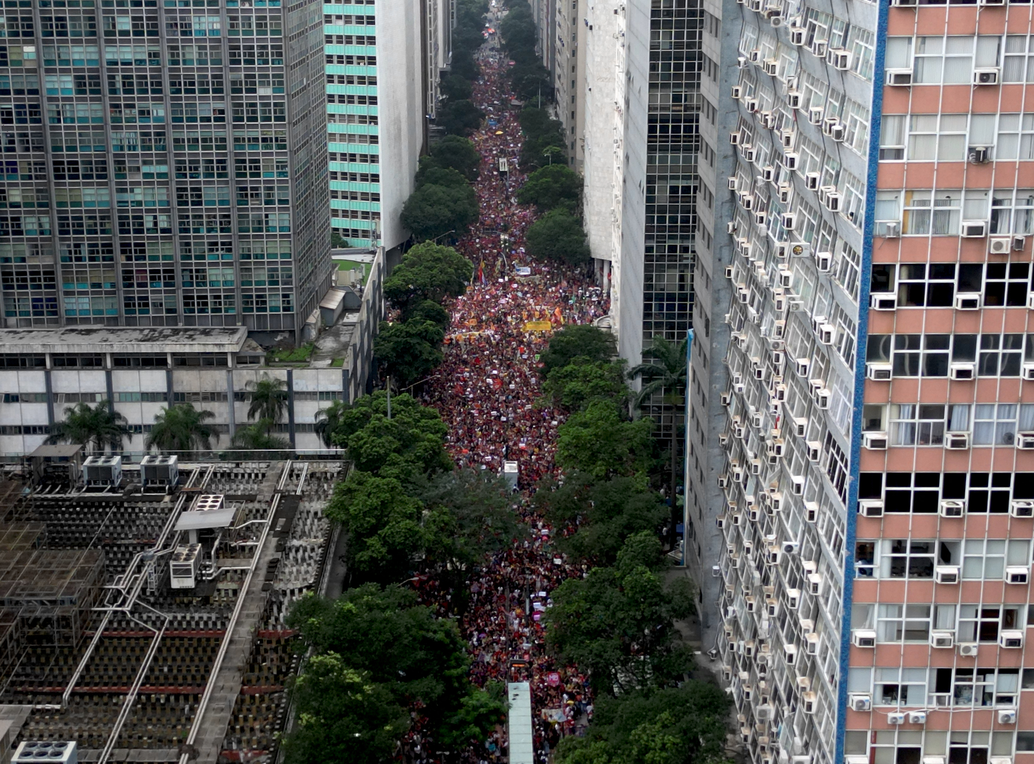 This aerial view shows students attending a demonstration in support of Brazil's President and presidential candidate Luiz Inacio Lula da Silva for the runoff election and against the far right, on their way to Cinelandia square in Rio de Janeiro, Brazil on October 7, 2026. Lula da Silva, who has risen from the political ashes several times, is heading to a runoff election against right-wing senator Flavio Bolsonaro on October 25, after a shock second-place finish in the first-round vote. [Mauro Pimentel/AFP]