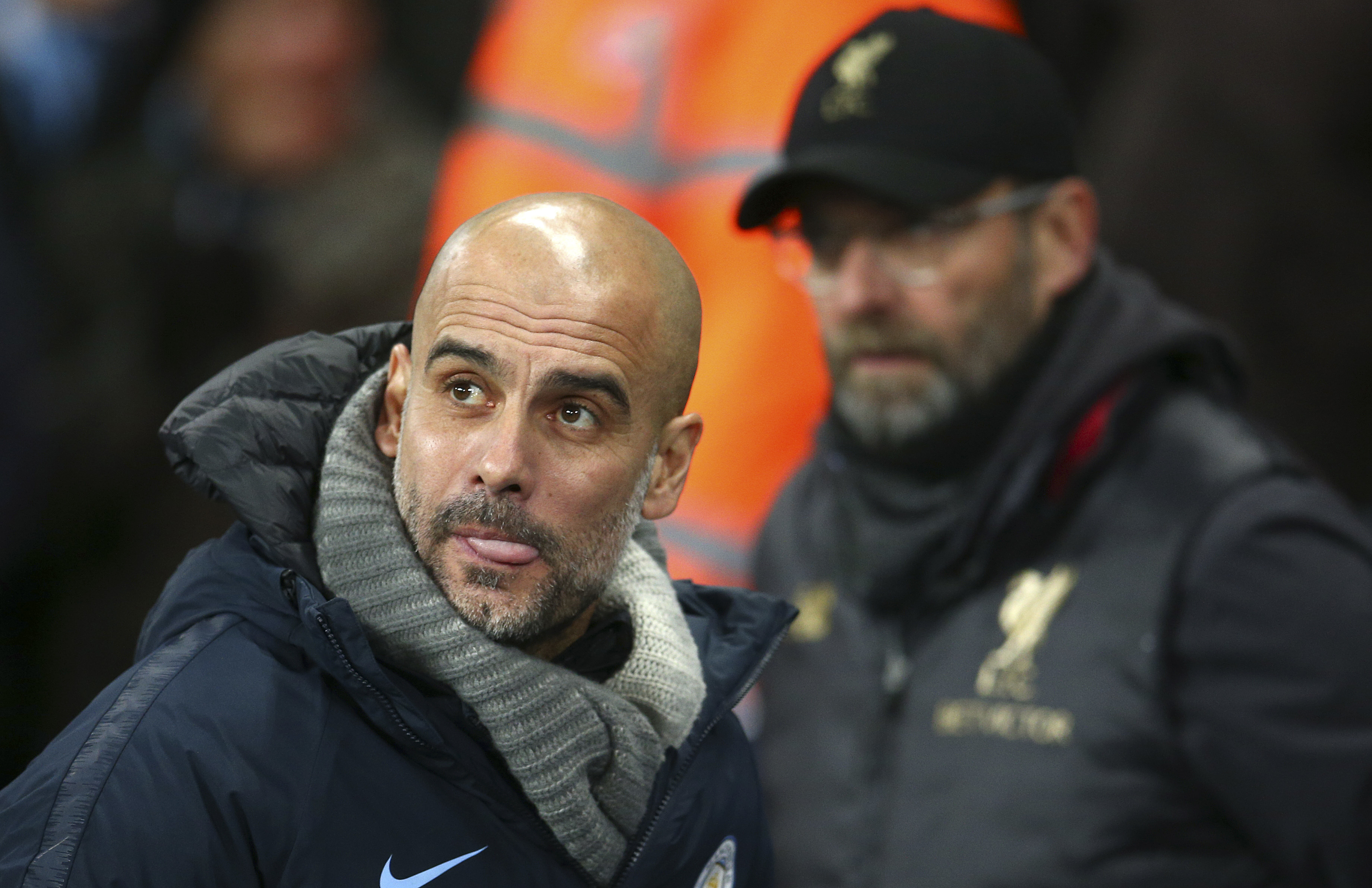 Manchester City manager Pep Guardiola reacts as Liverpool manager Jurgen Klopp marked one of the Premier League's fiercest rivalries