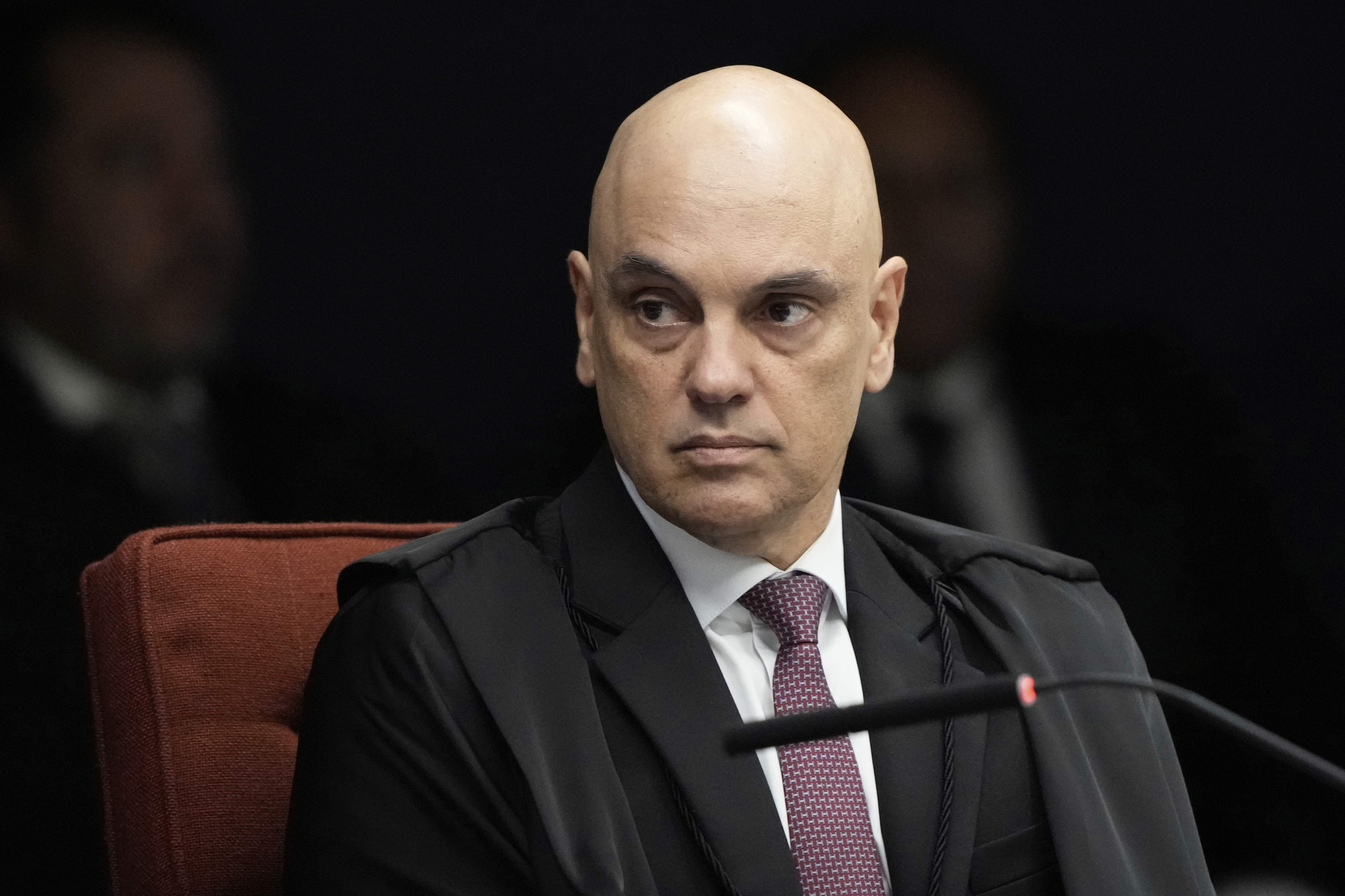 Supreme Court Justice Alexandre de Moraes attends the verdict and sentencing phase of a trial for those charged in an alleged coup plot to keep Brazil's former President Jair Bolsonaro in office after his 2022 election defeat, in Brasilia, Brazil, Thursday, Sept. 11, 2025. (AP Photo/Eraldo Peres)