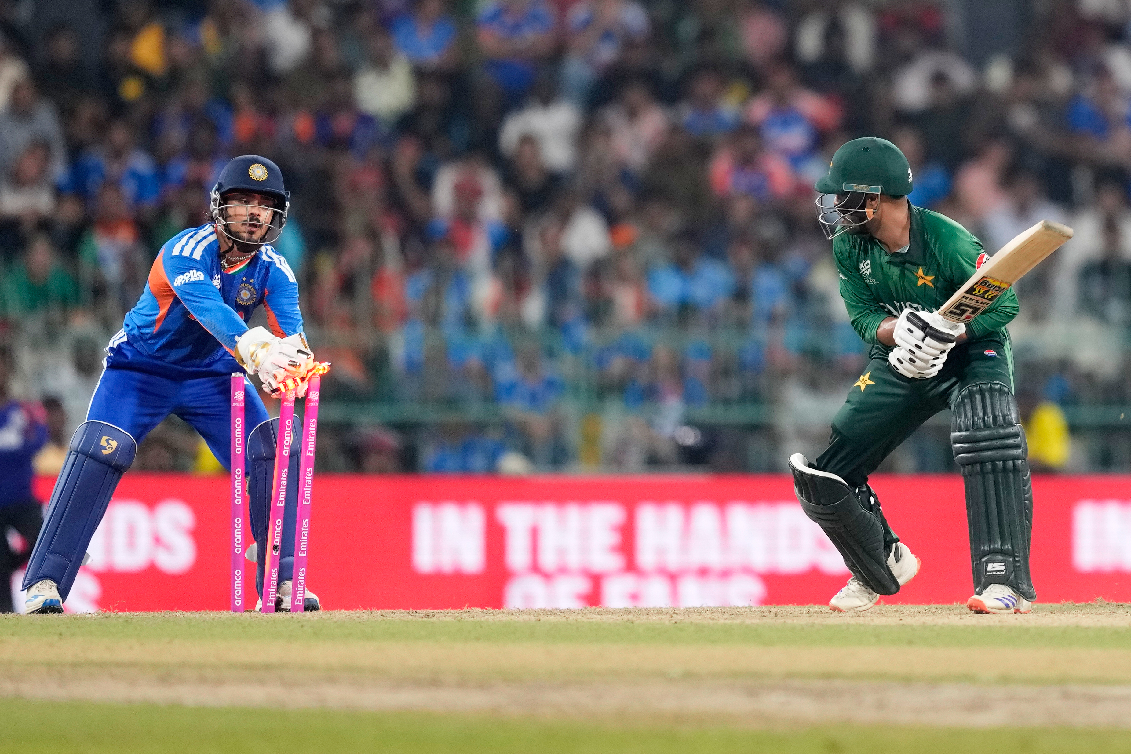 Pakistan's Usman Khan, right, is stumped out by India's Ishan Kishan during the T20 World Cup cricket match between India and Pakistan in Colombo, Sri Lanka, Sunday, Feb. 15, 2026. (AP Photo/Eranga Jayawardena)