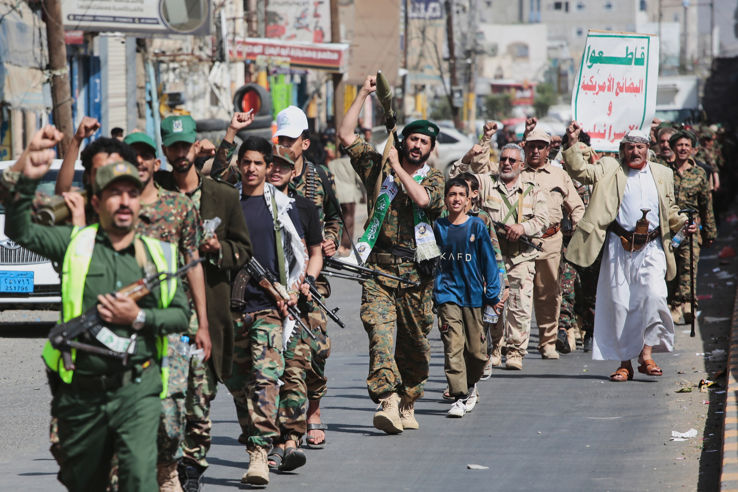 Yemen's Houthi rebels march during a mobilization campaign in Sanaa, Yemen, Thursday, Sept. 10, 2026. Placard in Arabic reads "boycott American and Israeli goods". (AP