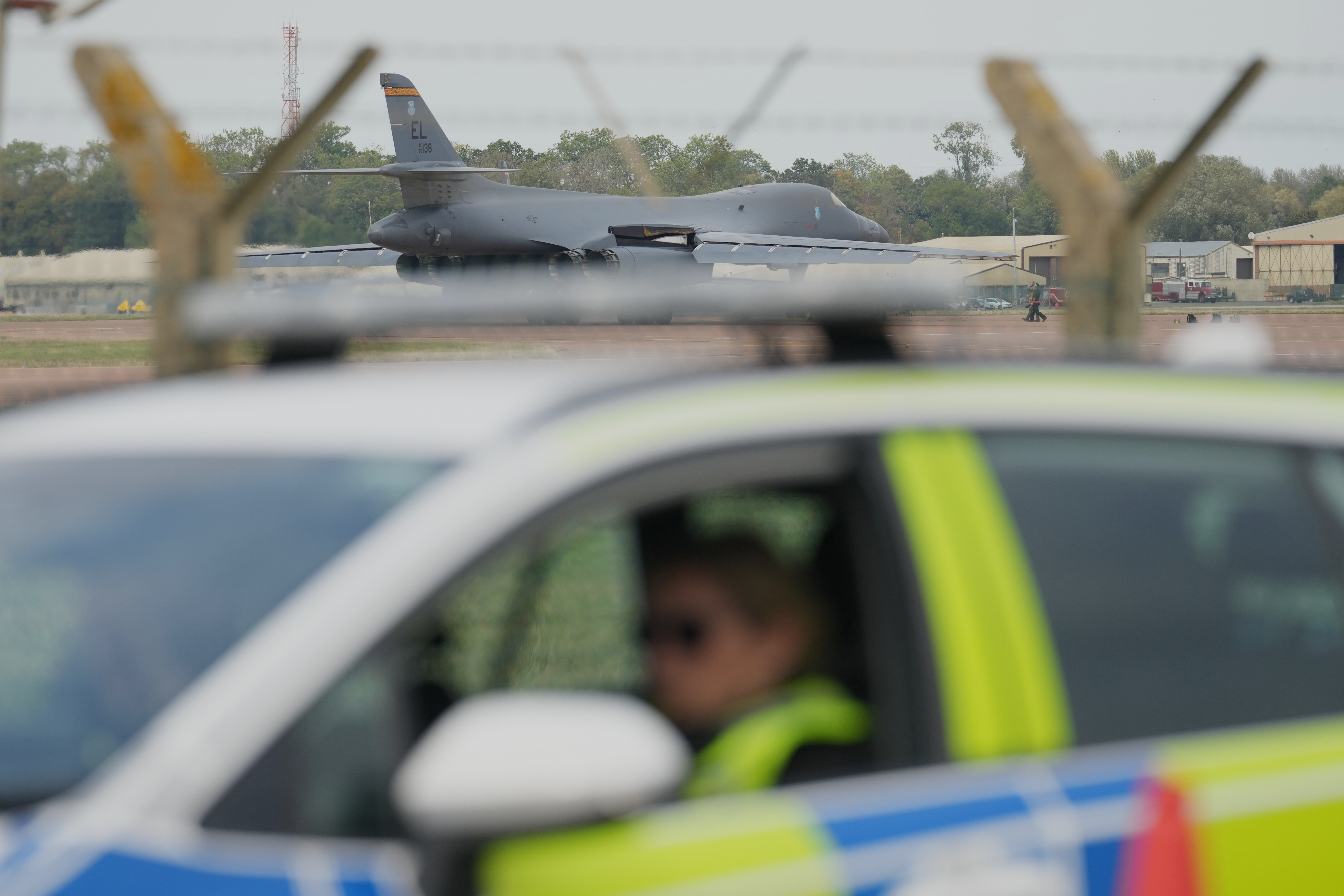 A B1 bomber prepares to take off as police officers man a checkpoint near RAF Fairford air base, in Fairford, England Tuesday, September 29, 2026 [Alastair Grant/AP]