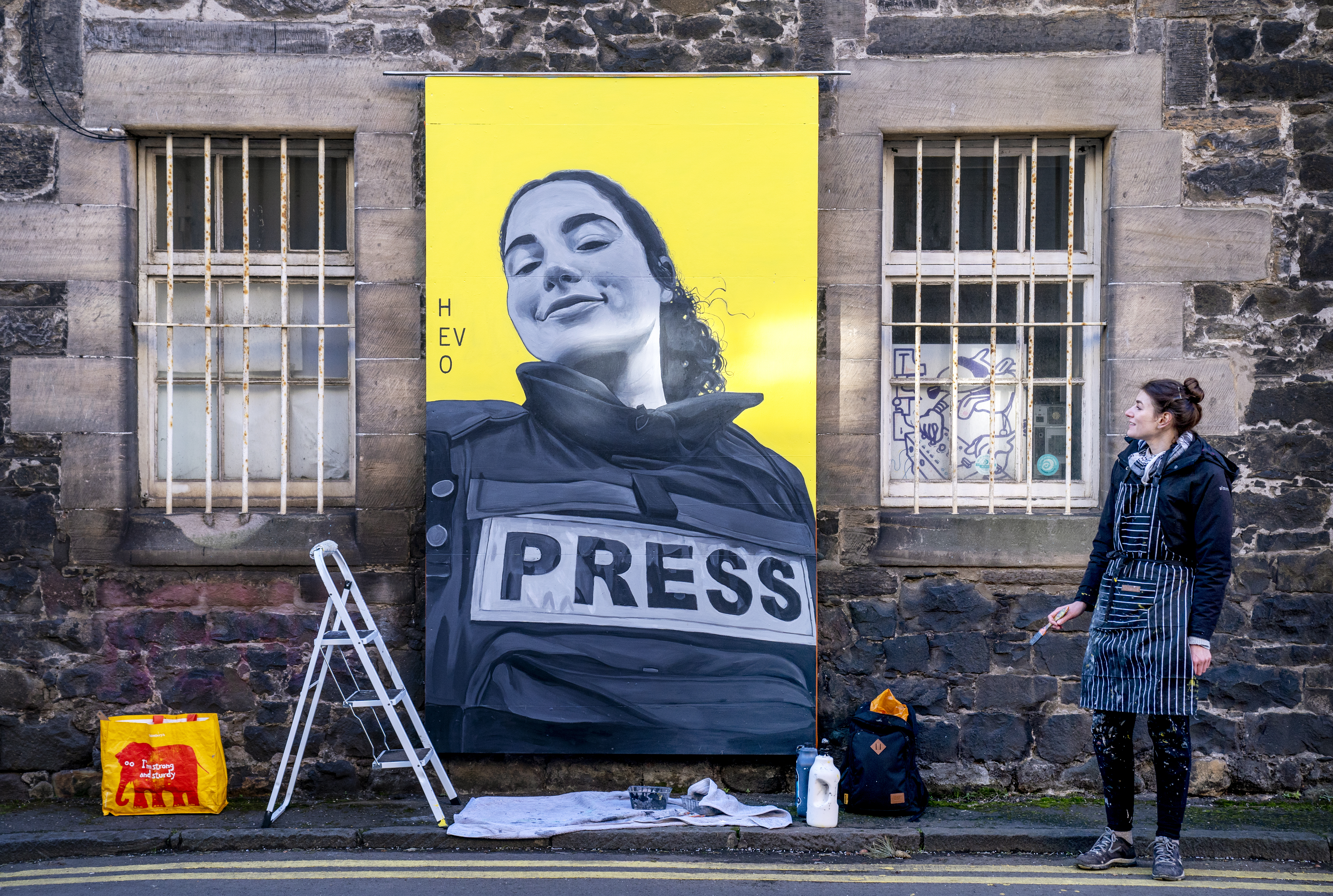 Artist and illustrator Anna Dittmann, from Abbeyhill, Edinburgh, works on a mural at Quality Yard in Leith, that features Bisan Owda, a 25-year-old journalist in Palestine