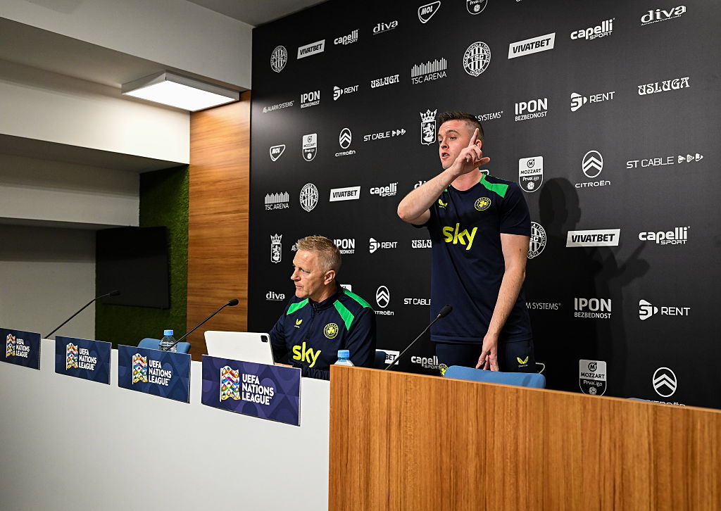 Communications manager Kieran Crowley signals an end the press conference alongside head coach Heimir Hallgrimsson during a Republic of Ireland media conference at the TSC Arena in Baka Topola, Serbia