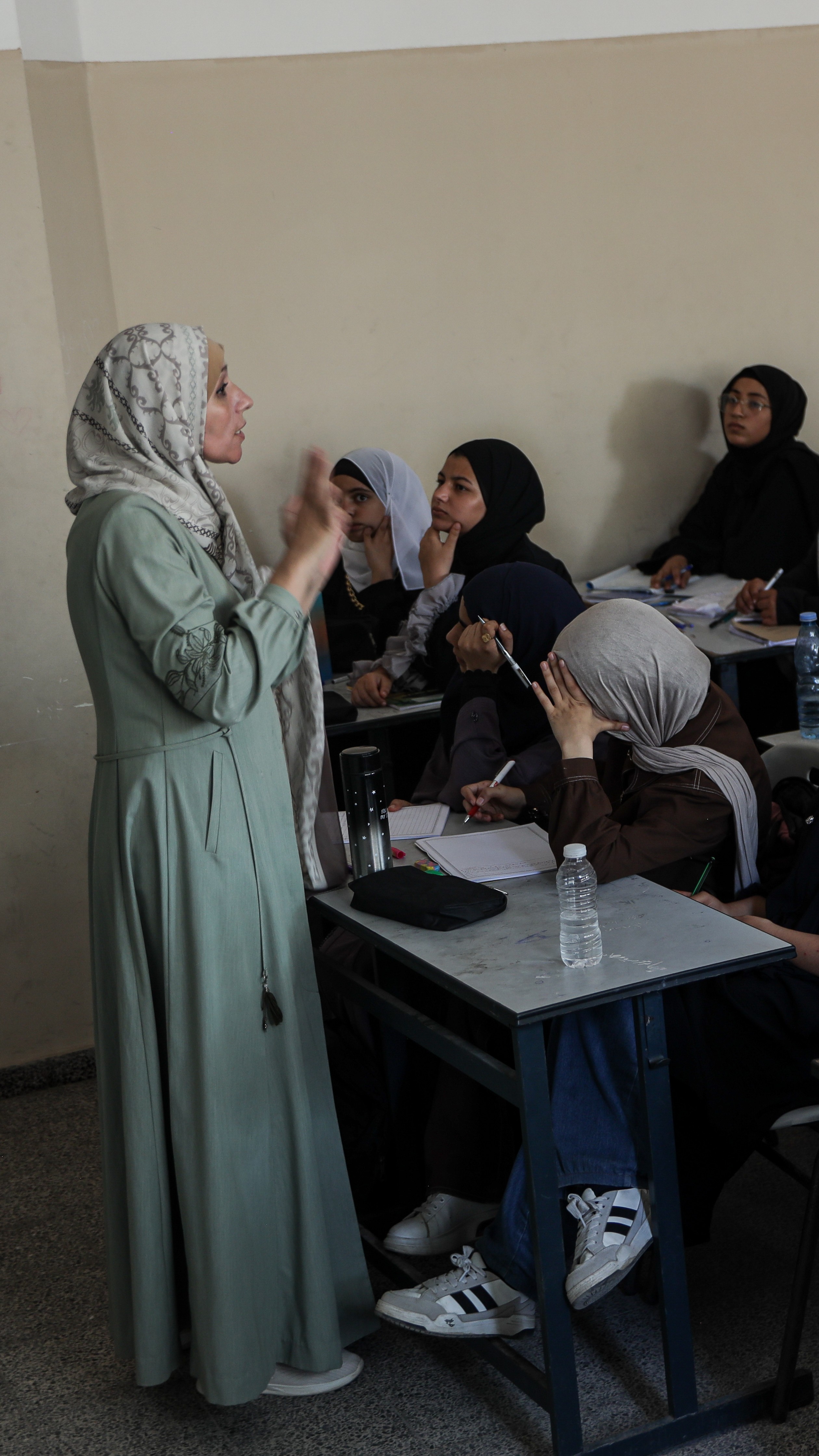 Maha Taha now teaches classes of 45 girls. After years of war, hunger and displacement, she says she has become less concerned with strict rules and more attentive to the difficulties her students face outside the classroom