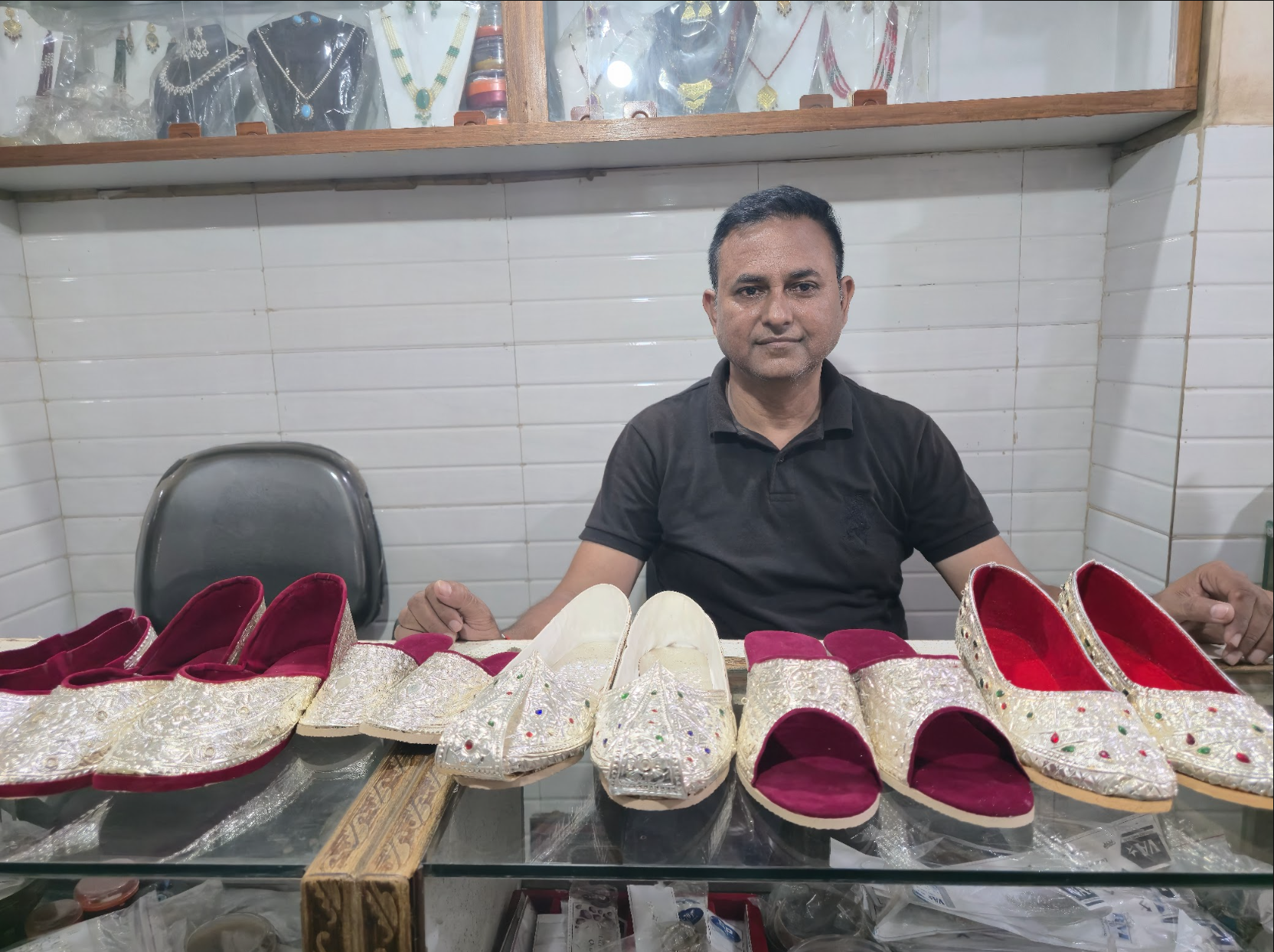 Jabbar Hussain shows the pairs of nagras he has made this year. He once made dozens of pairs every year, but demand for the craft has now declined sharply [Aatif Ammad/Al Jazeera]